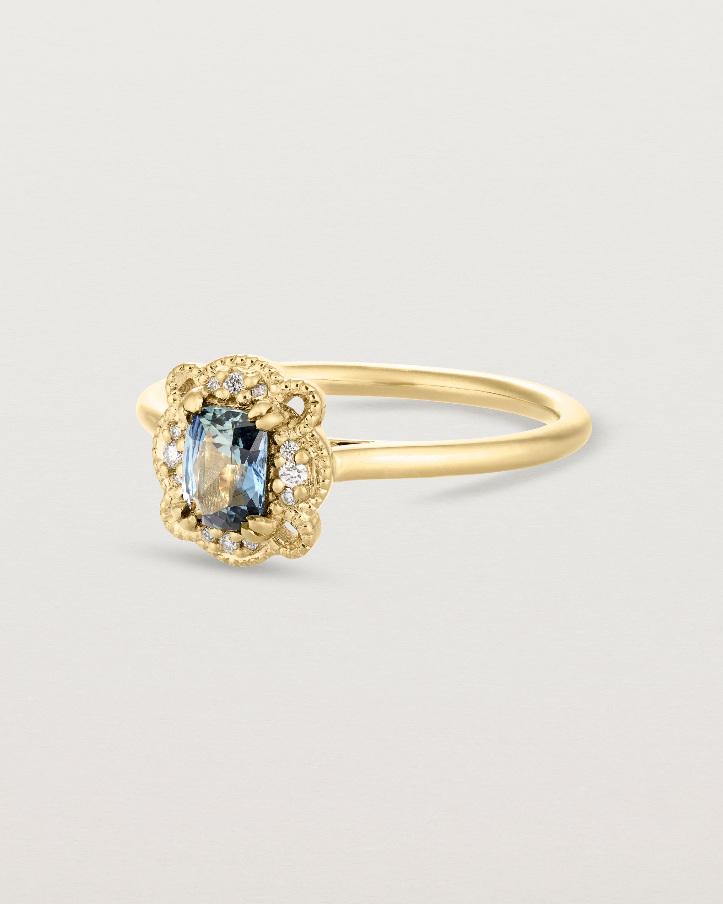 Angled view of the Jolie Millgrain Halo Ring | Parti Sapphire.