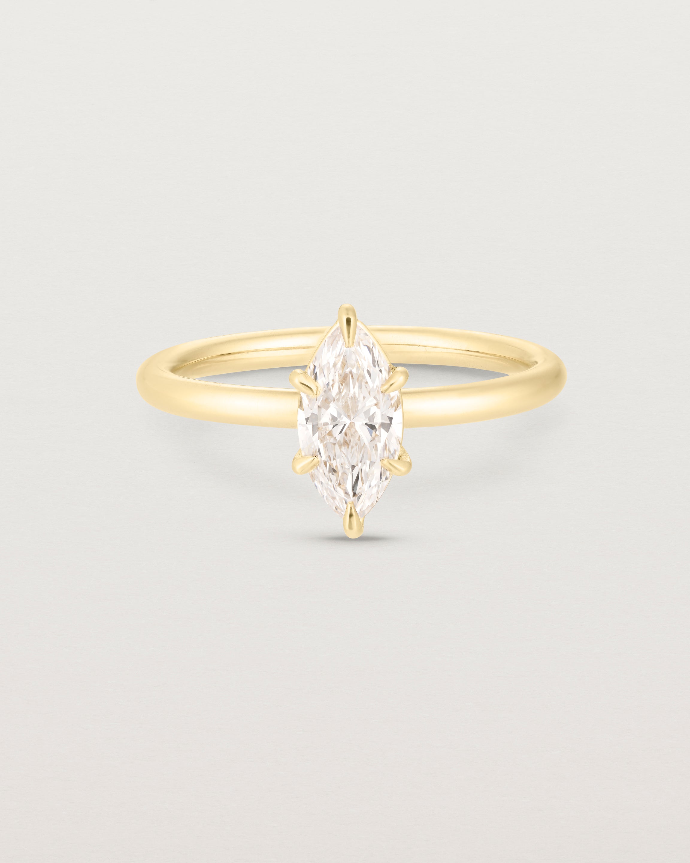 Front image of diamond marquise ring in yellow gold