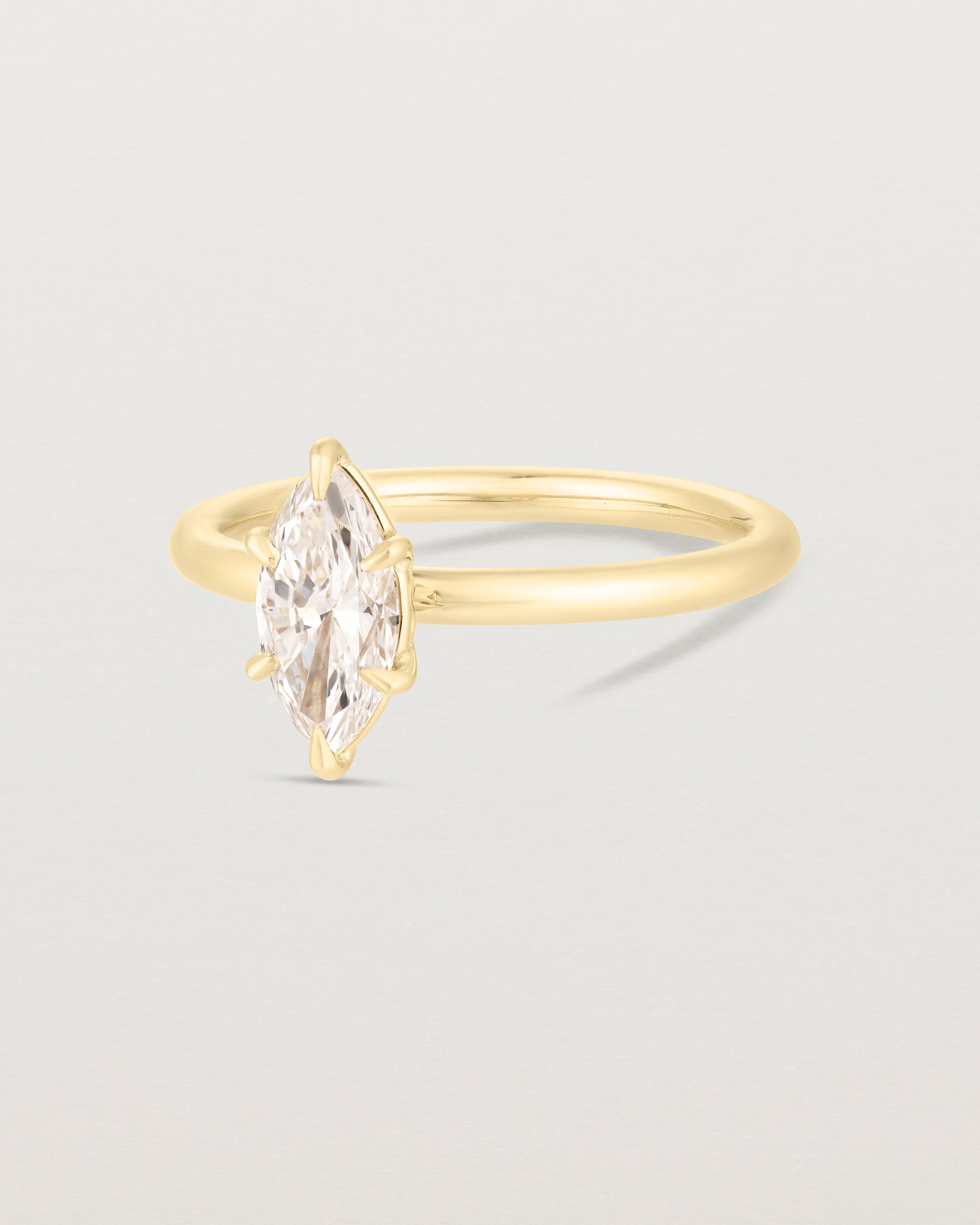 Side image of diamond marquise ring in yellow gold