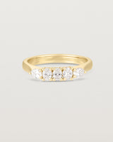 Front on image of diamond engagement ring in yellow gold. Featuring five white diamonds.