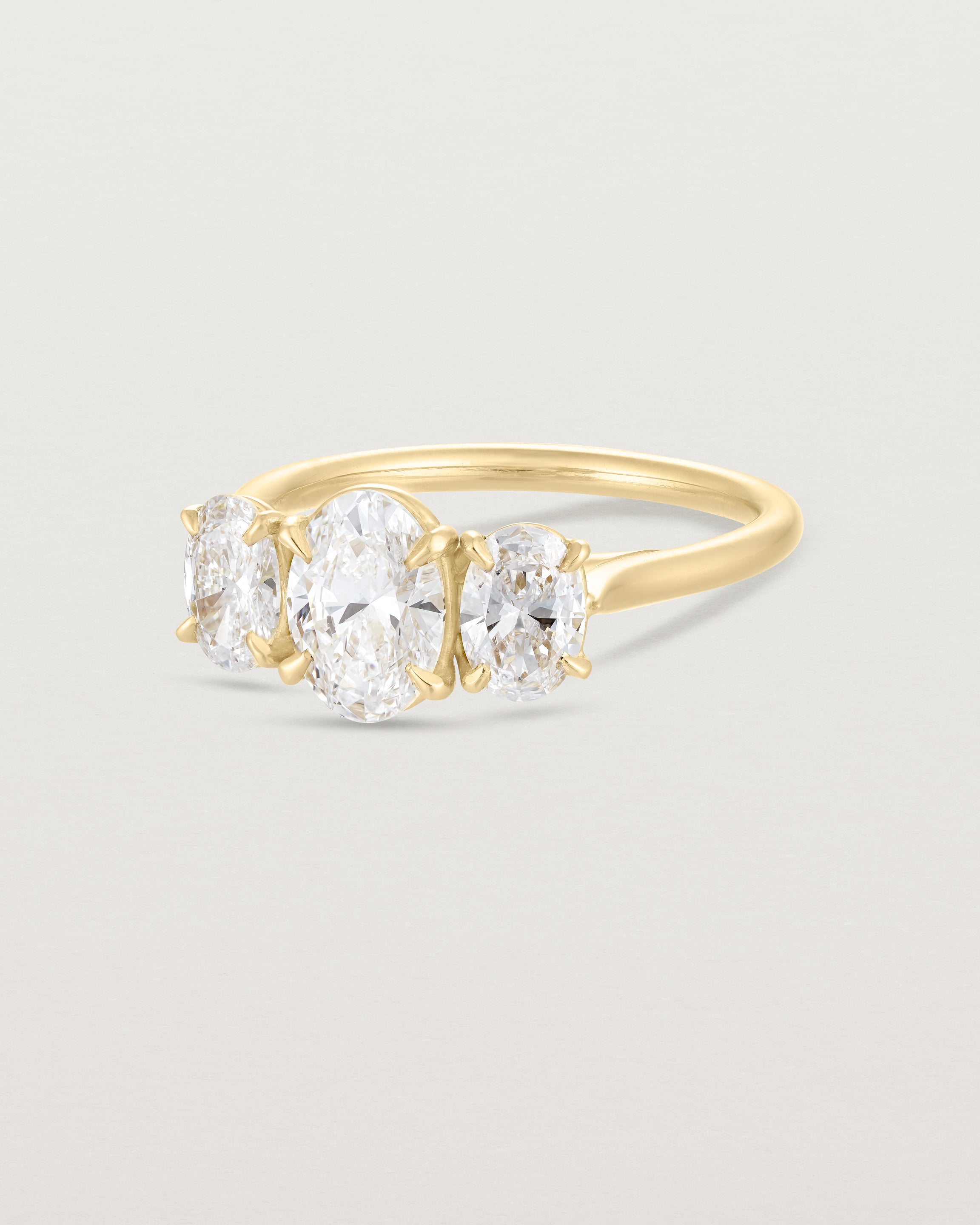 Angled view of the Kahlia Trio Ring | Laboratory Grown Diamonds in yellow gold.