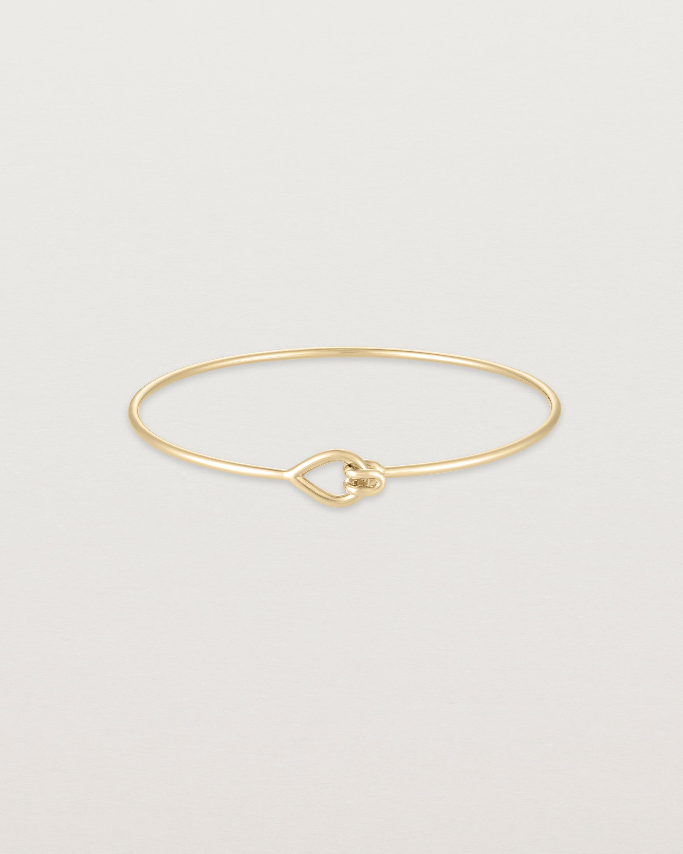 Front view of the Oana Bangle in yellow gold.