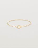 Front view of the Oana Bangle in yellow gold.