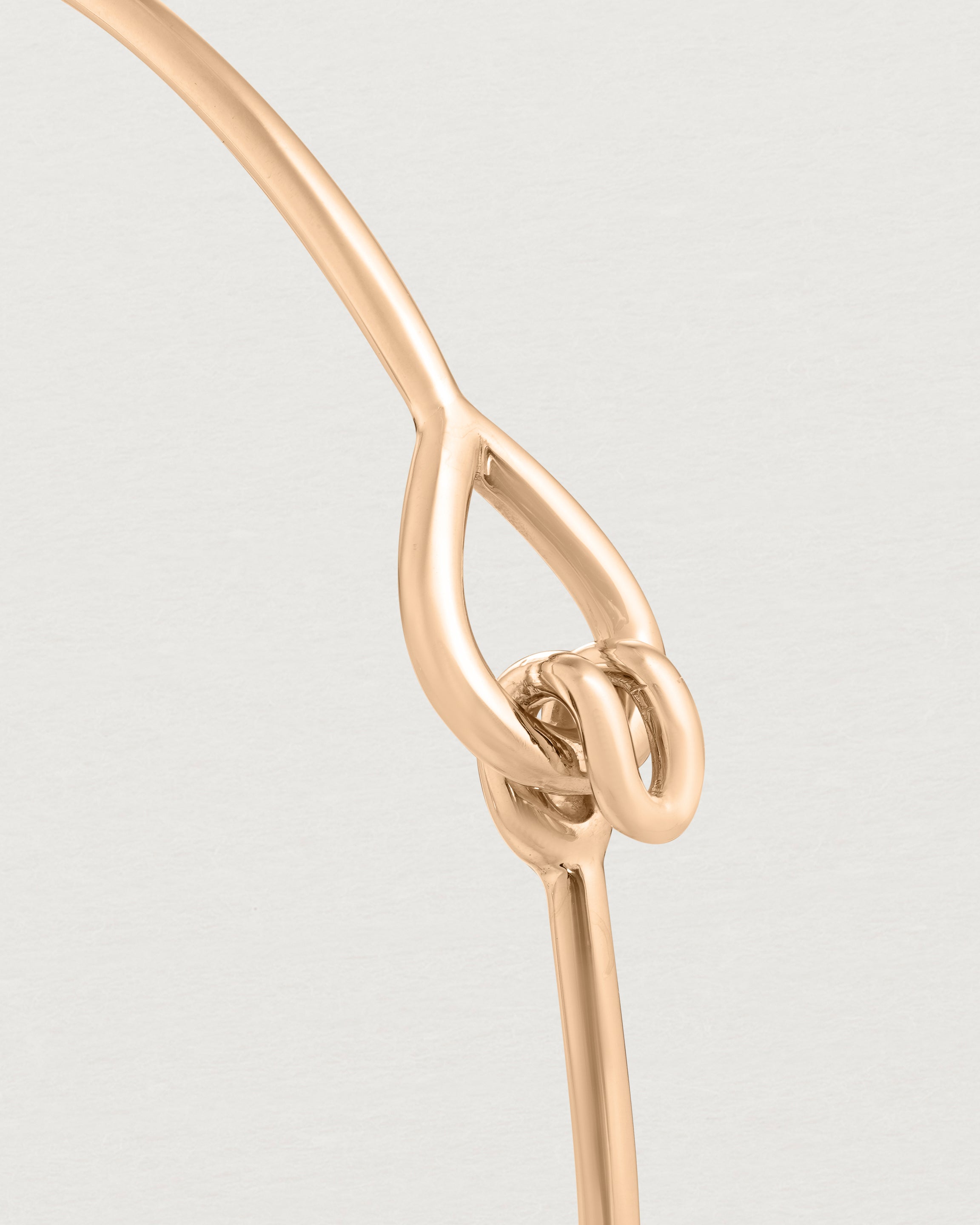 Close up view of the Oana Bangle in rose gold.