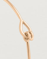 Close up view of the Oana Bangle in rose gold.