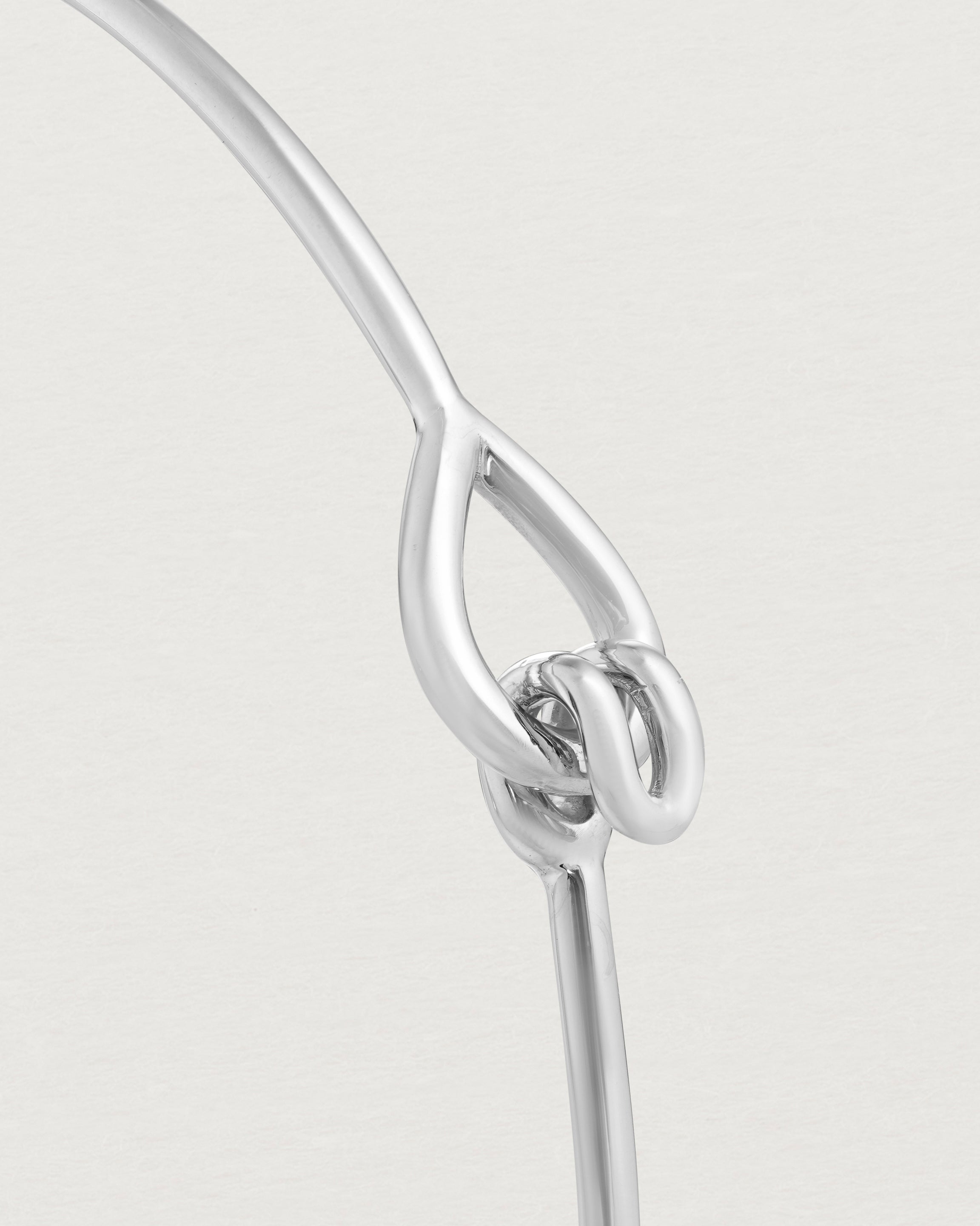 Close up view of the Oana Bangle in sterling silver.