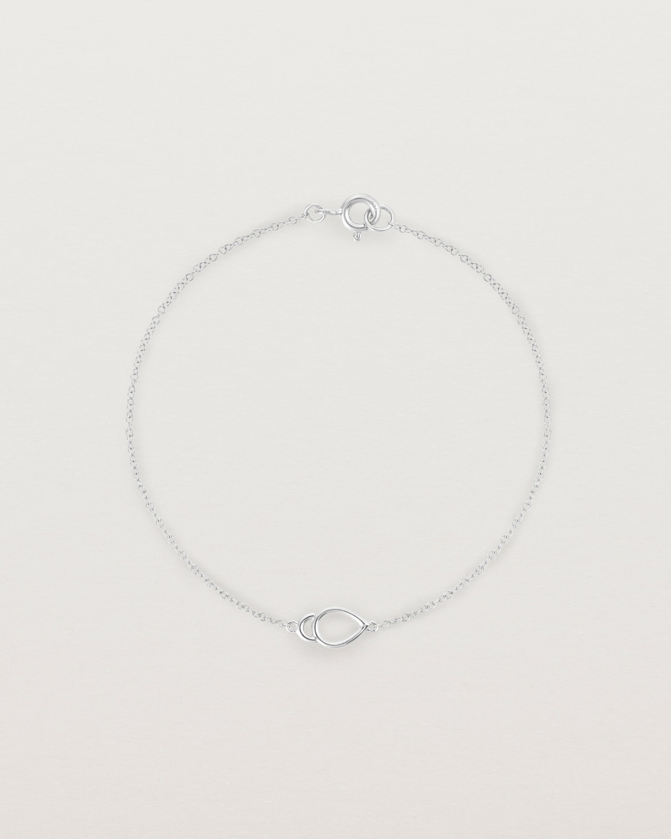 A sterling silver chain with an oval pendant