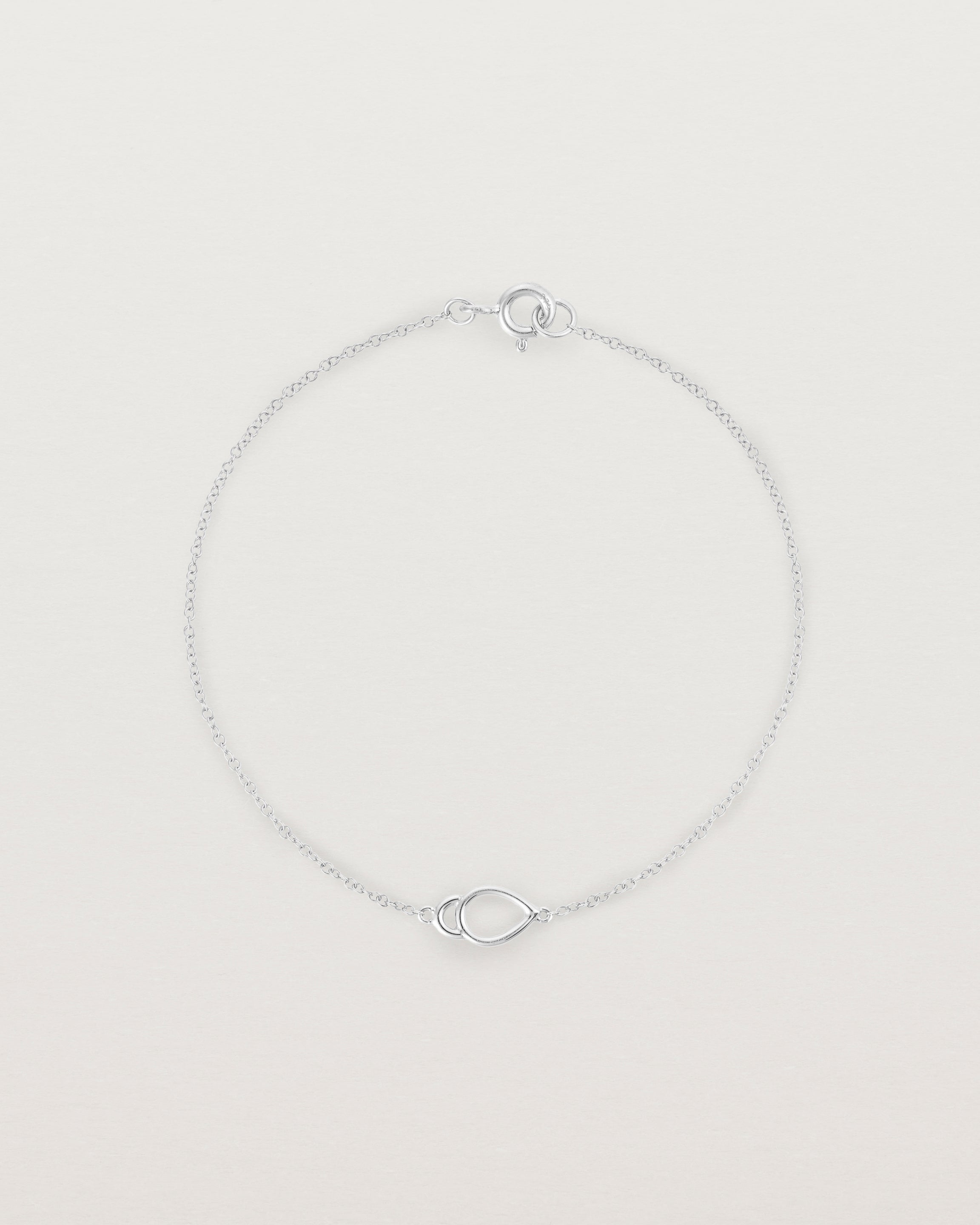 A sterling silver chain with an oval pendant