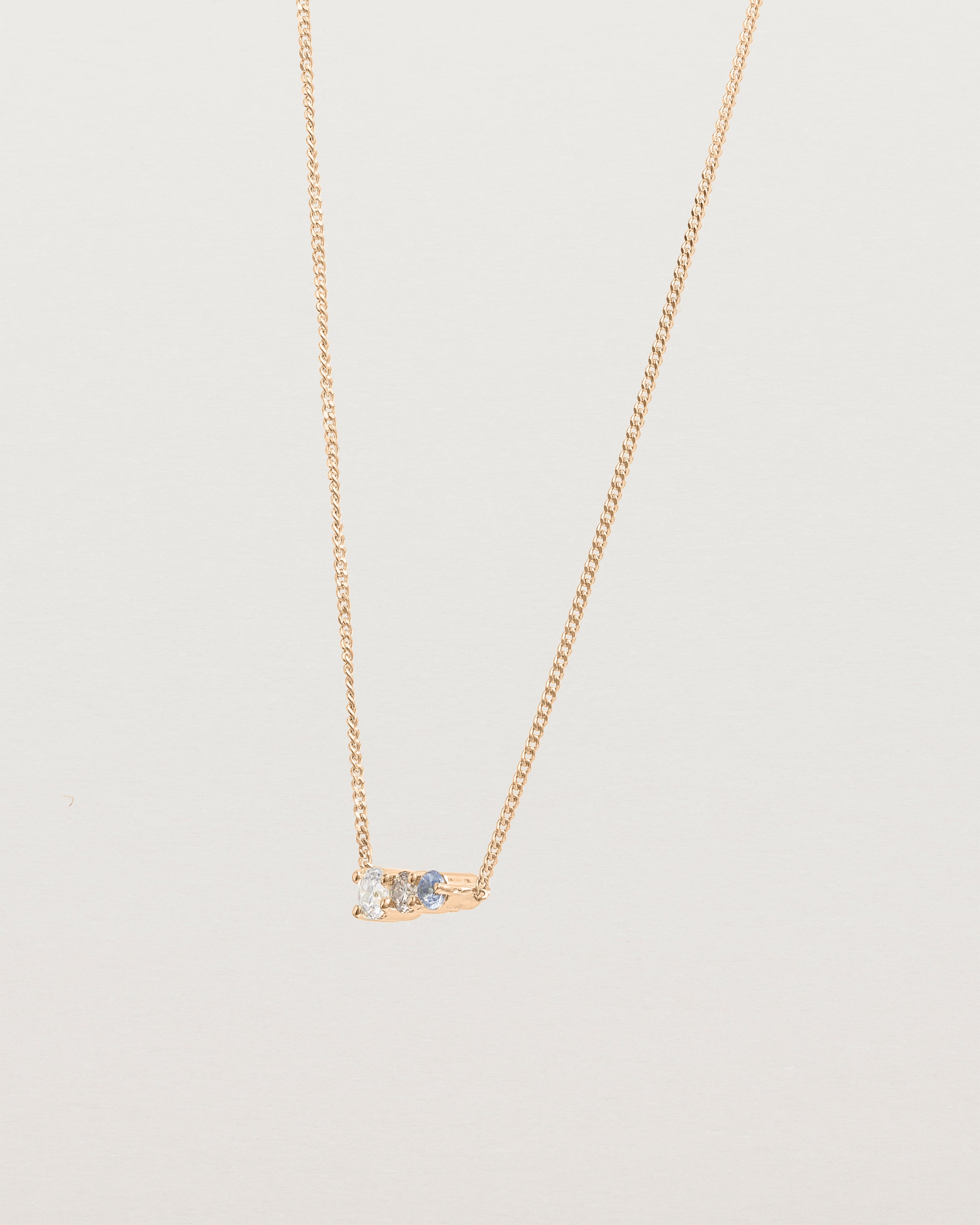 Angled view of the Ode Necklace | Diamond & Sapphire | Rose Gold