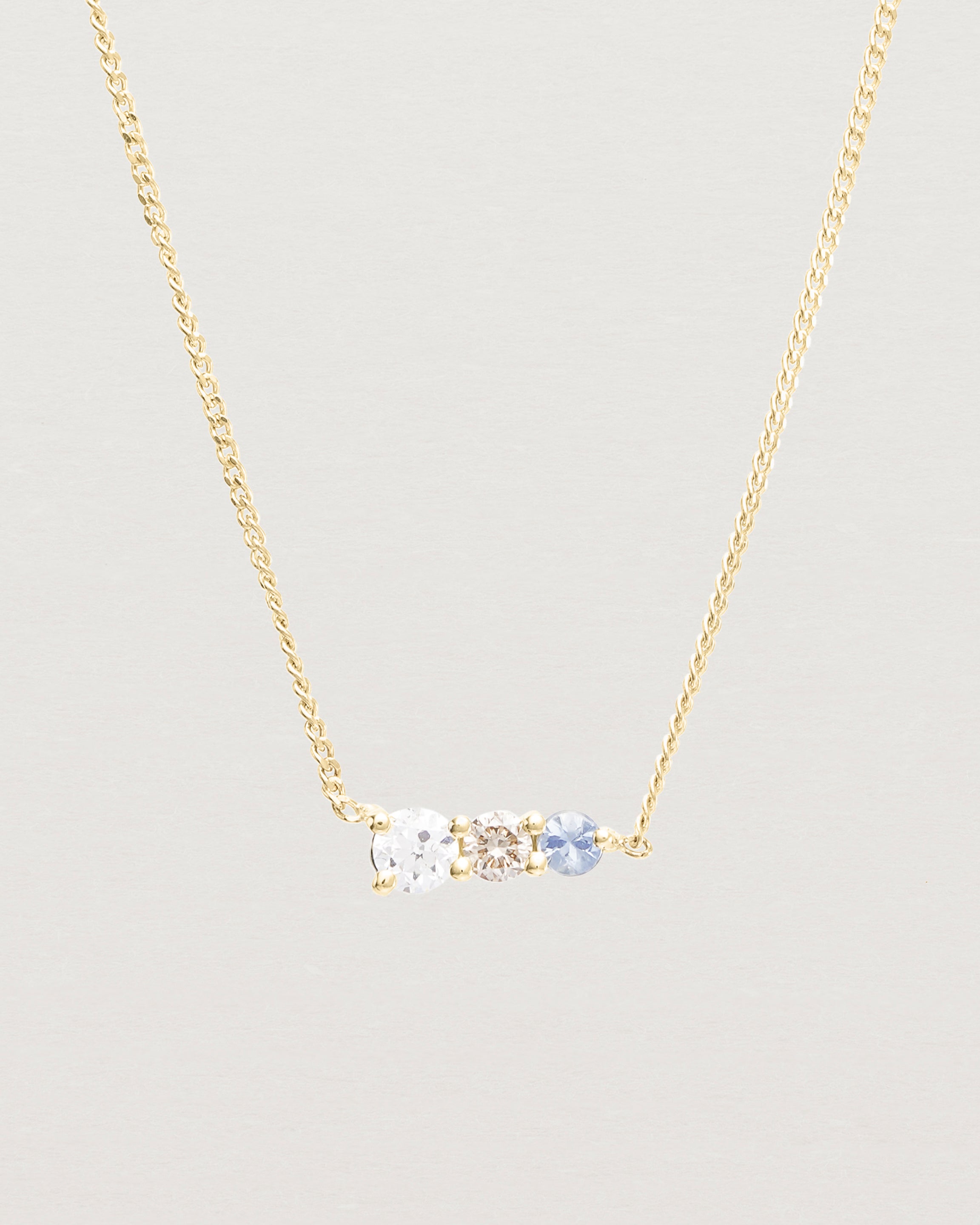 Close up view of the Ode Necklace | Diamond & Sapphire | Yellow Gold