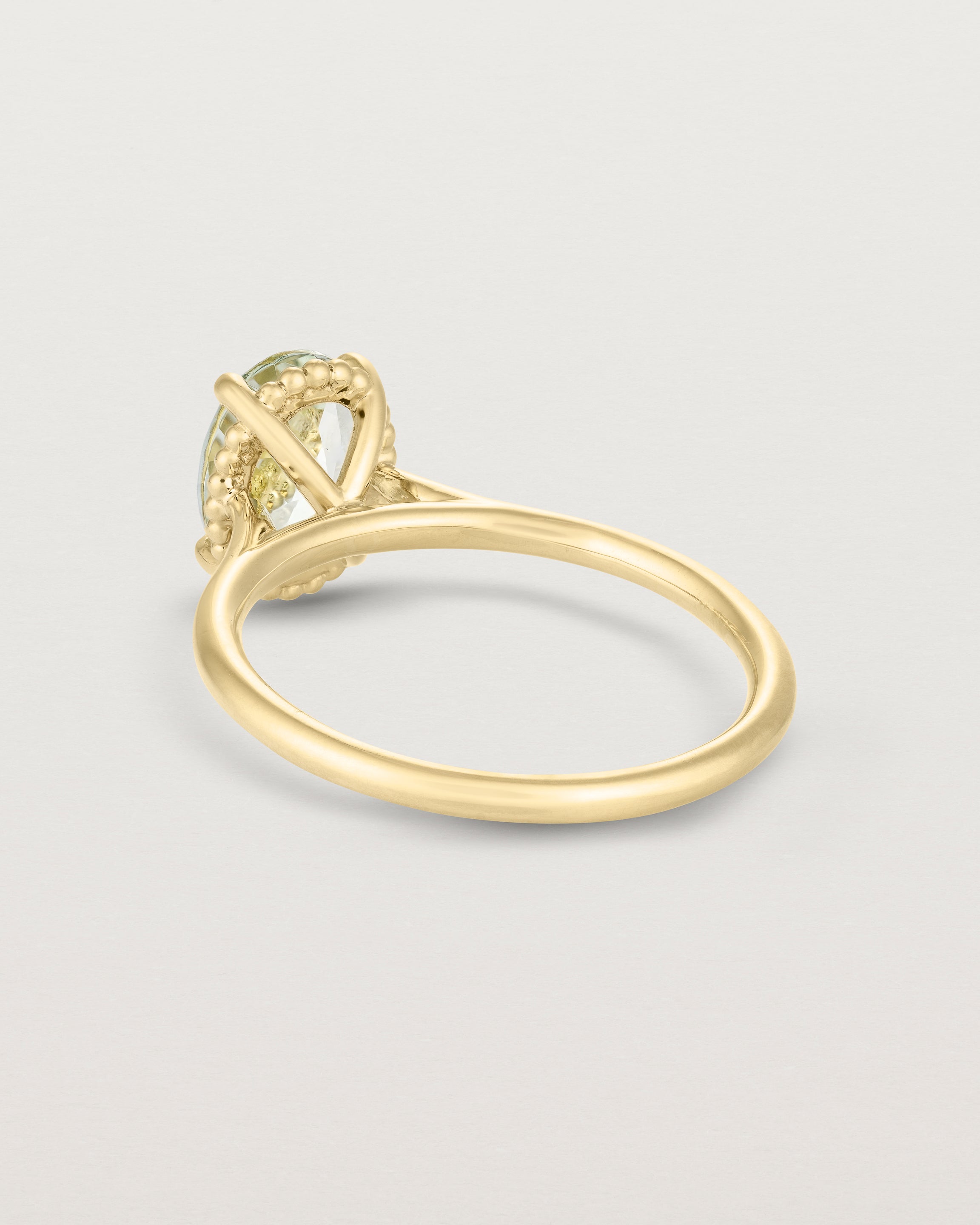 Back view of the Thea Oval Solitaire | Green Amethyst in yellow gold.
