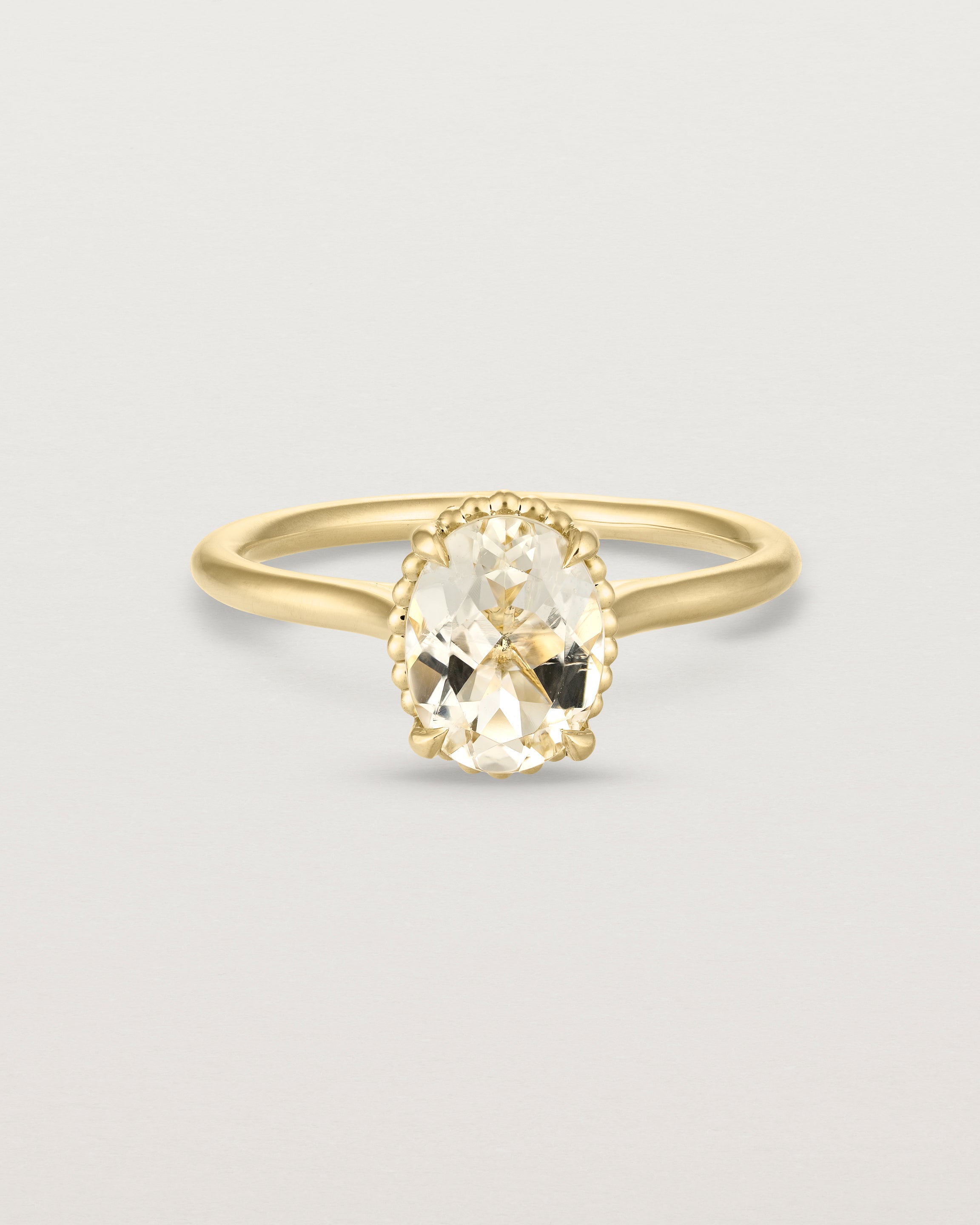 Front view of the Thea Oval Solitaire | Savannah Sunstone in yellow gold.