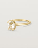 Angled view of the Thea Oval Solitaire | Savannah Sunstone in yellow gold.