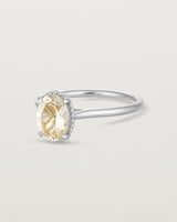 Angled view of the Thea Oval Solitaire | Savannah Sunstone in white gold.