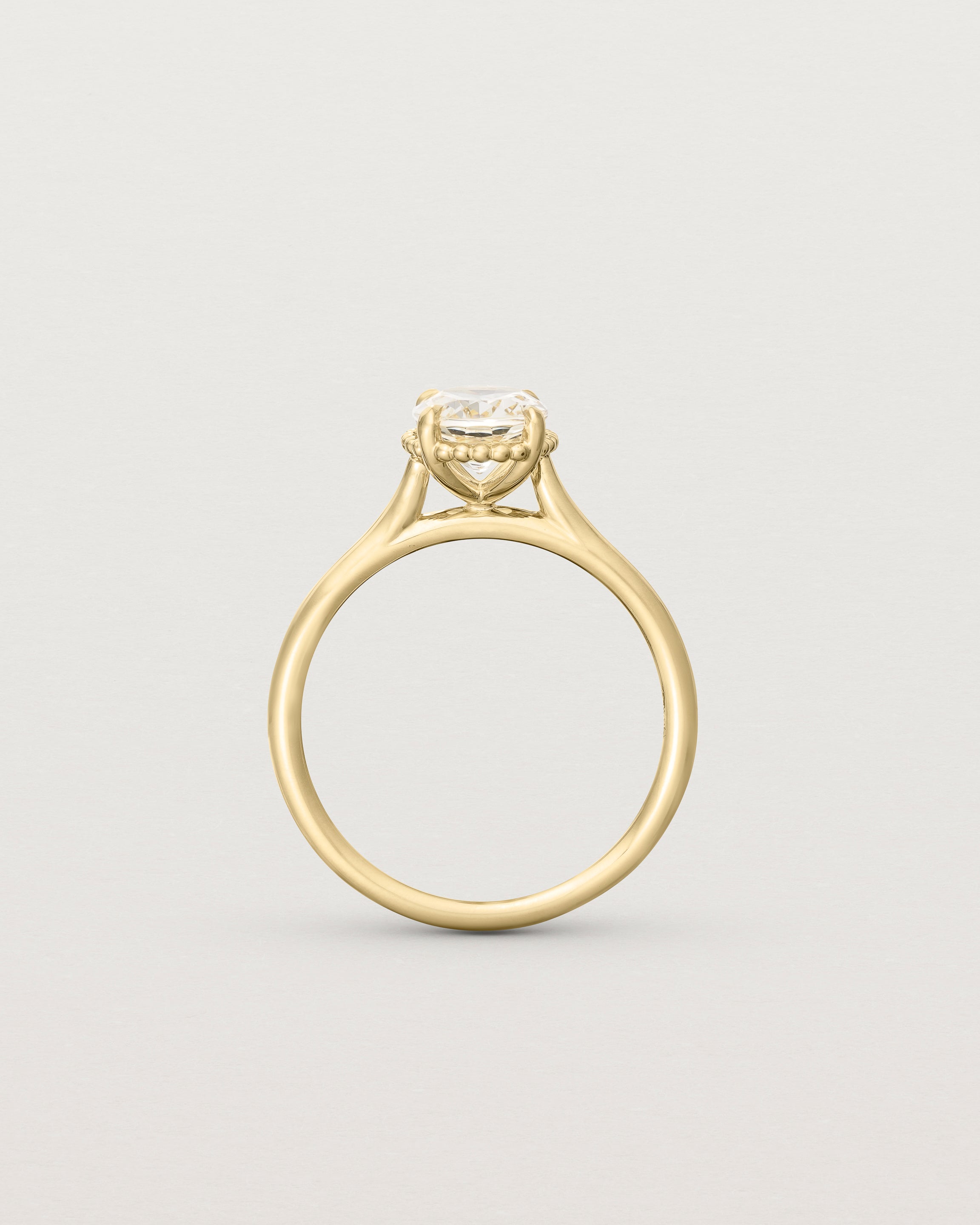 Standing view of the Thea Oval Solitaire | Savannah Sunstone in yellow gold.