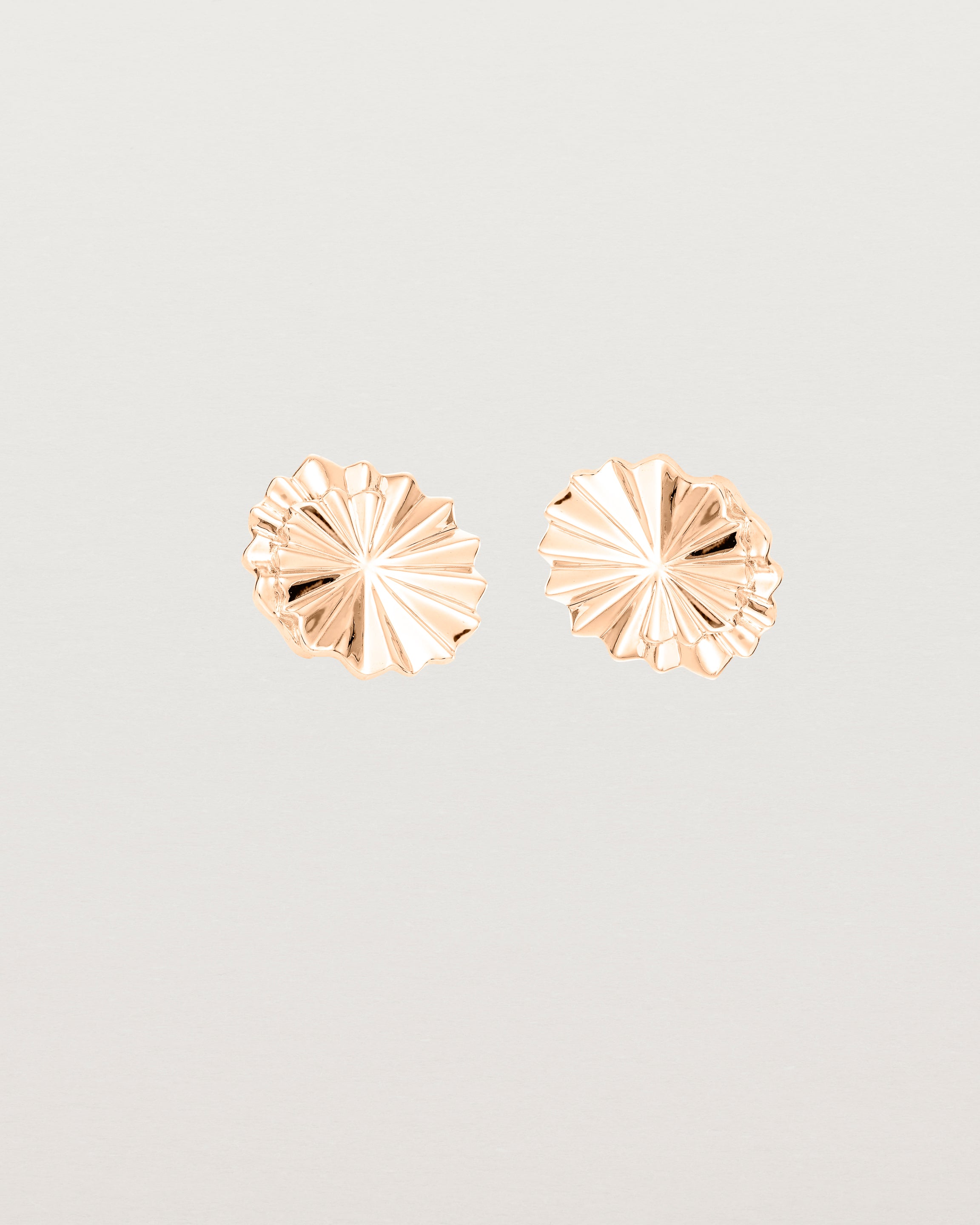 Front view of the Pan Earrings in rose gold.