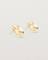Angled view of the Pan Earrings in yellow gold.