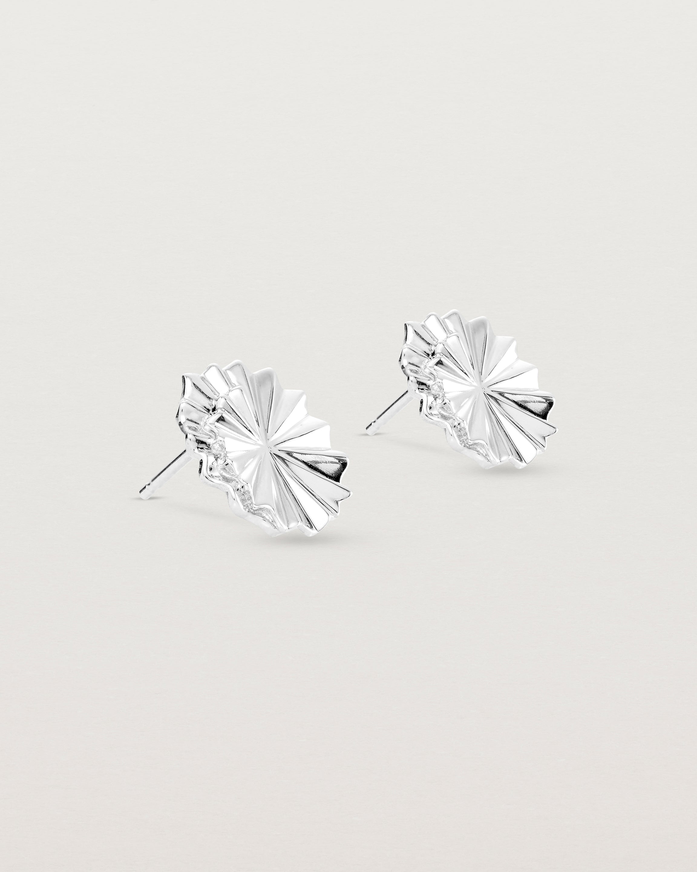 Angled view of the Pan Earrings in sterling silver.
