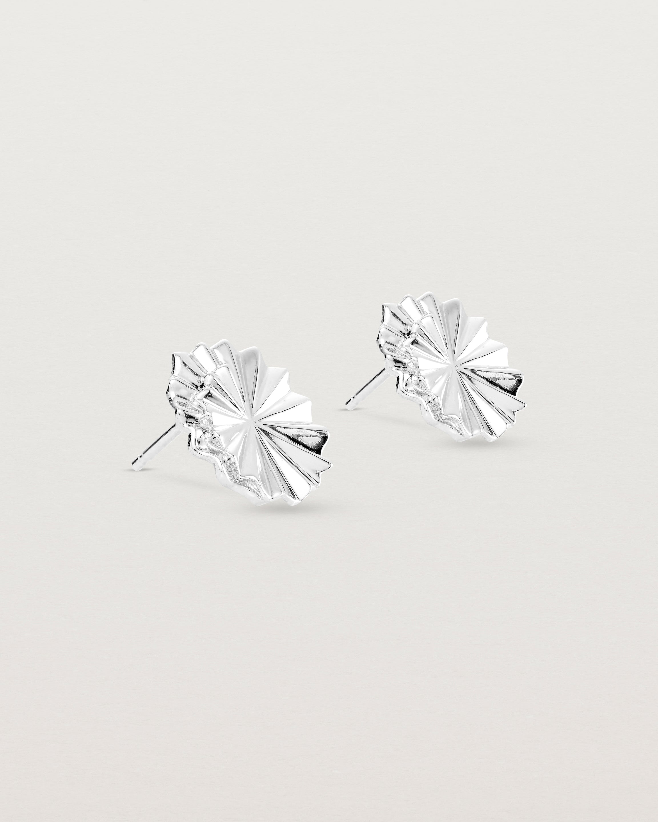 Angled view of the Pan Earrings in sterling silver.