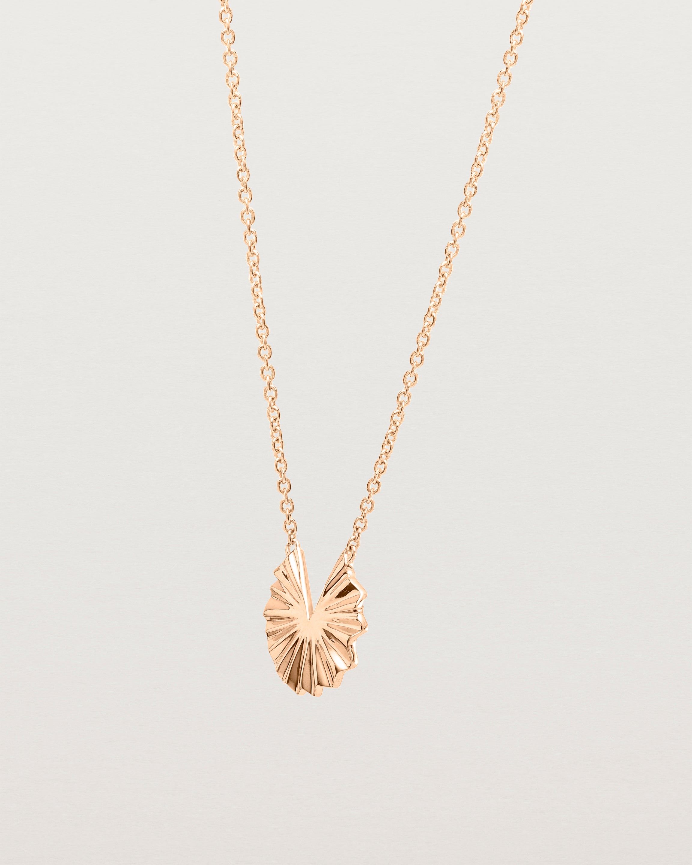 Angled view of the Pan Necklace | Rose Gold.