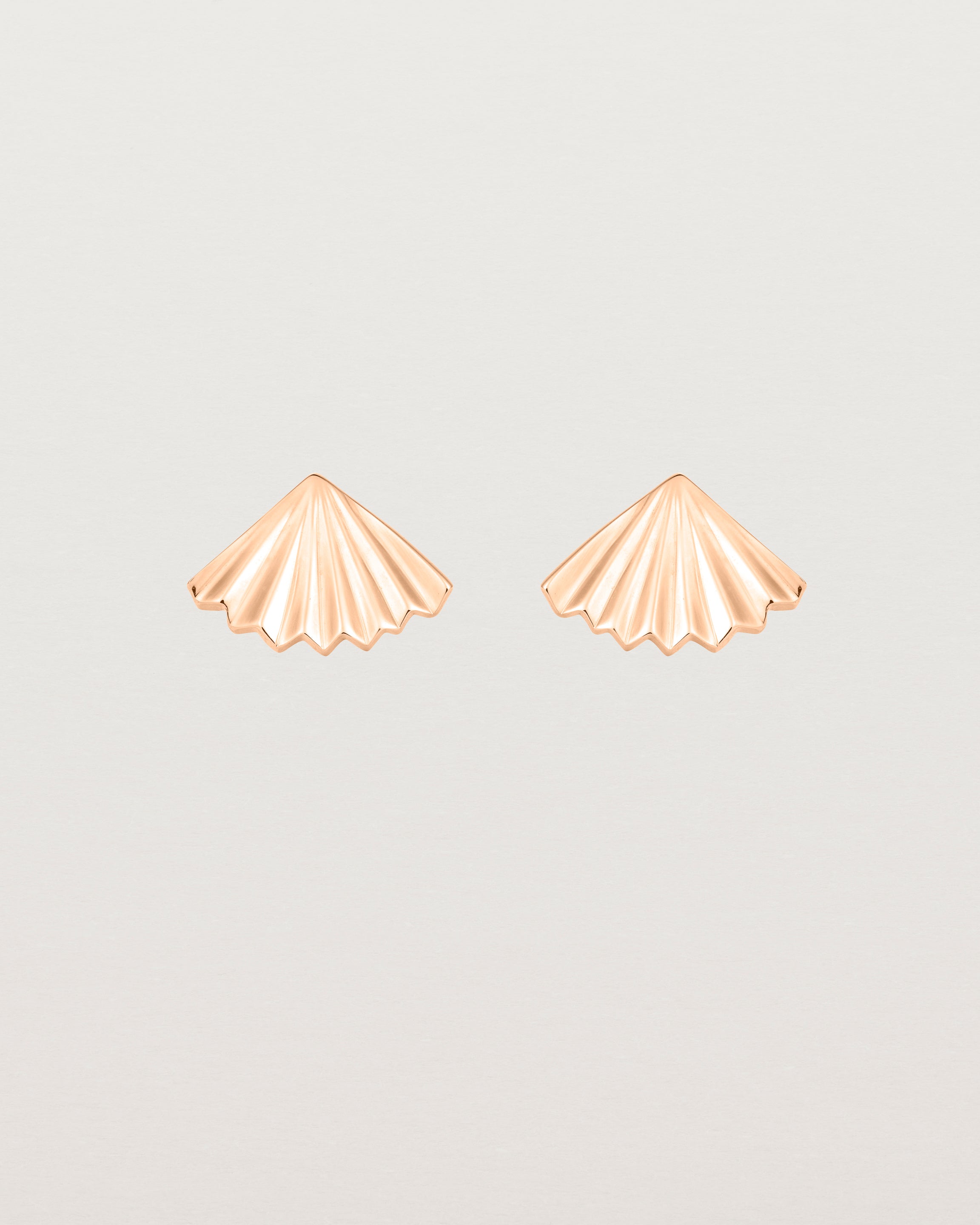 A pair of fan shaped rose gold earrings