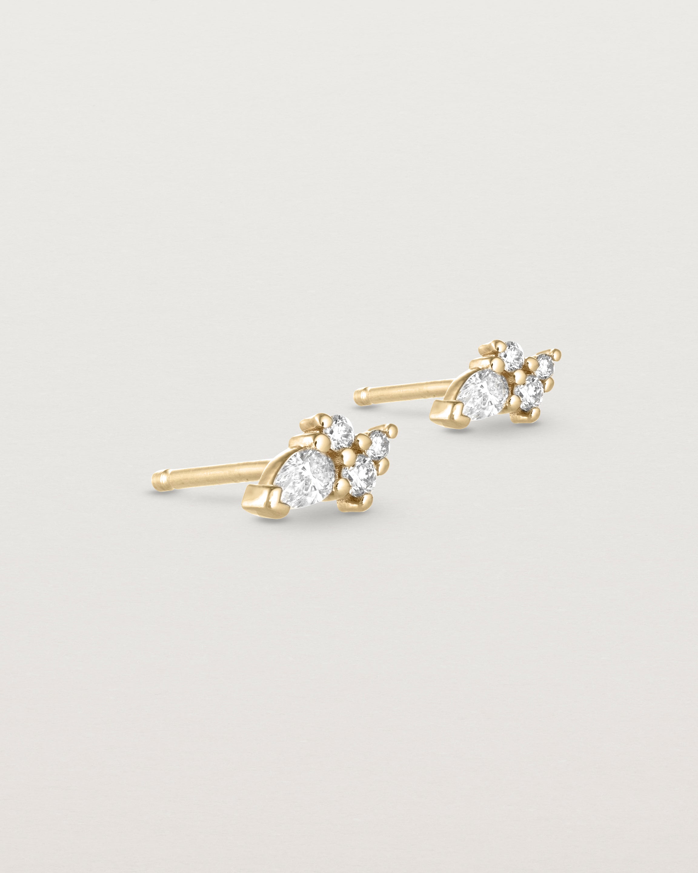 Angled view of the Pear Cluster Studs | Diamonds | Yellow Gold