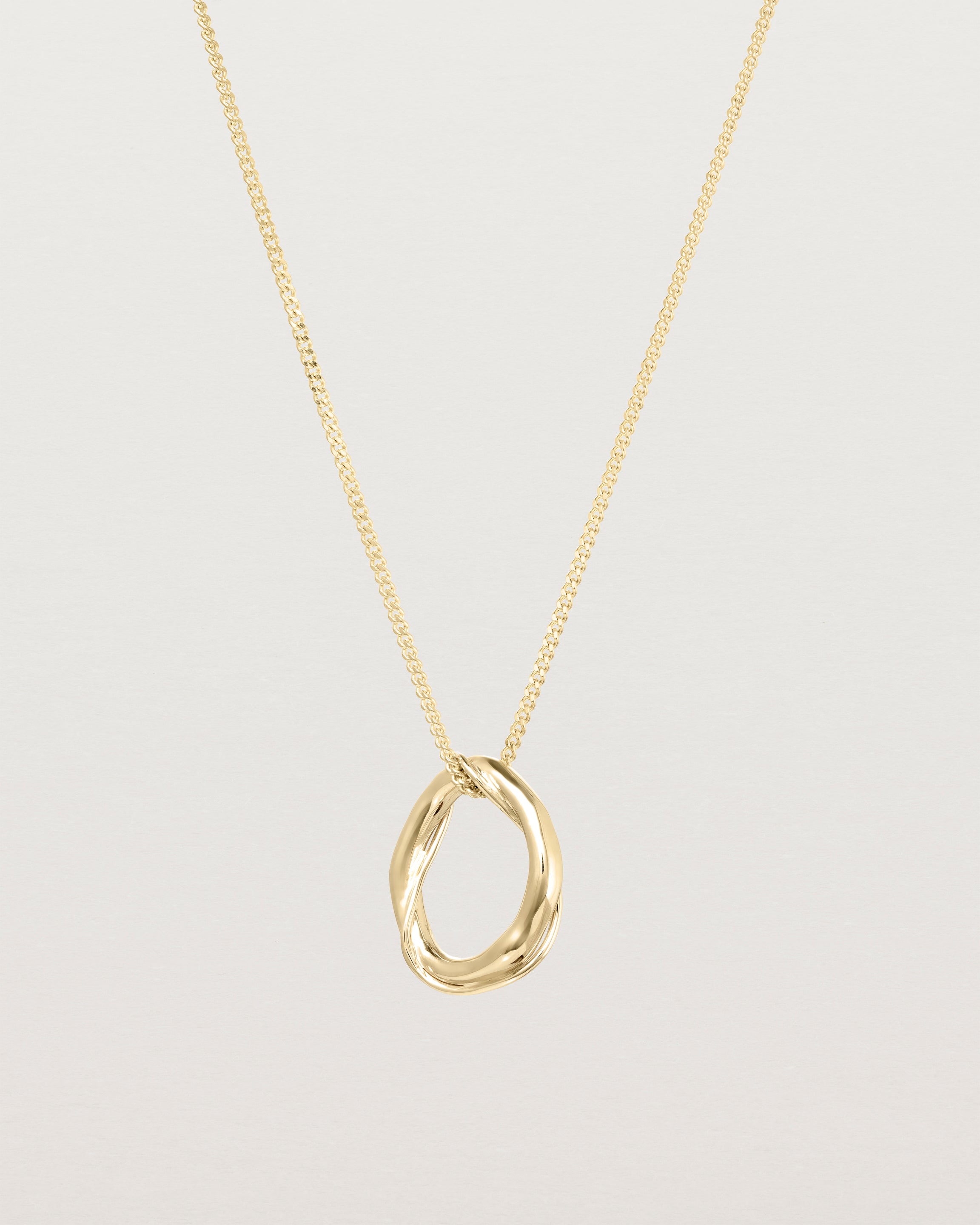 Front view of the Petite Dalí Necklace in yellow gold.