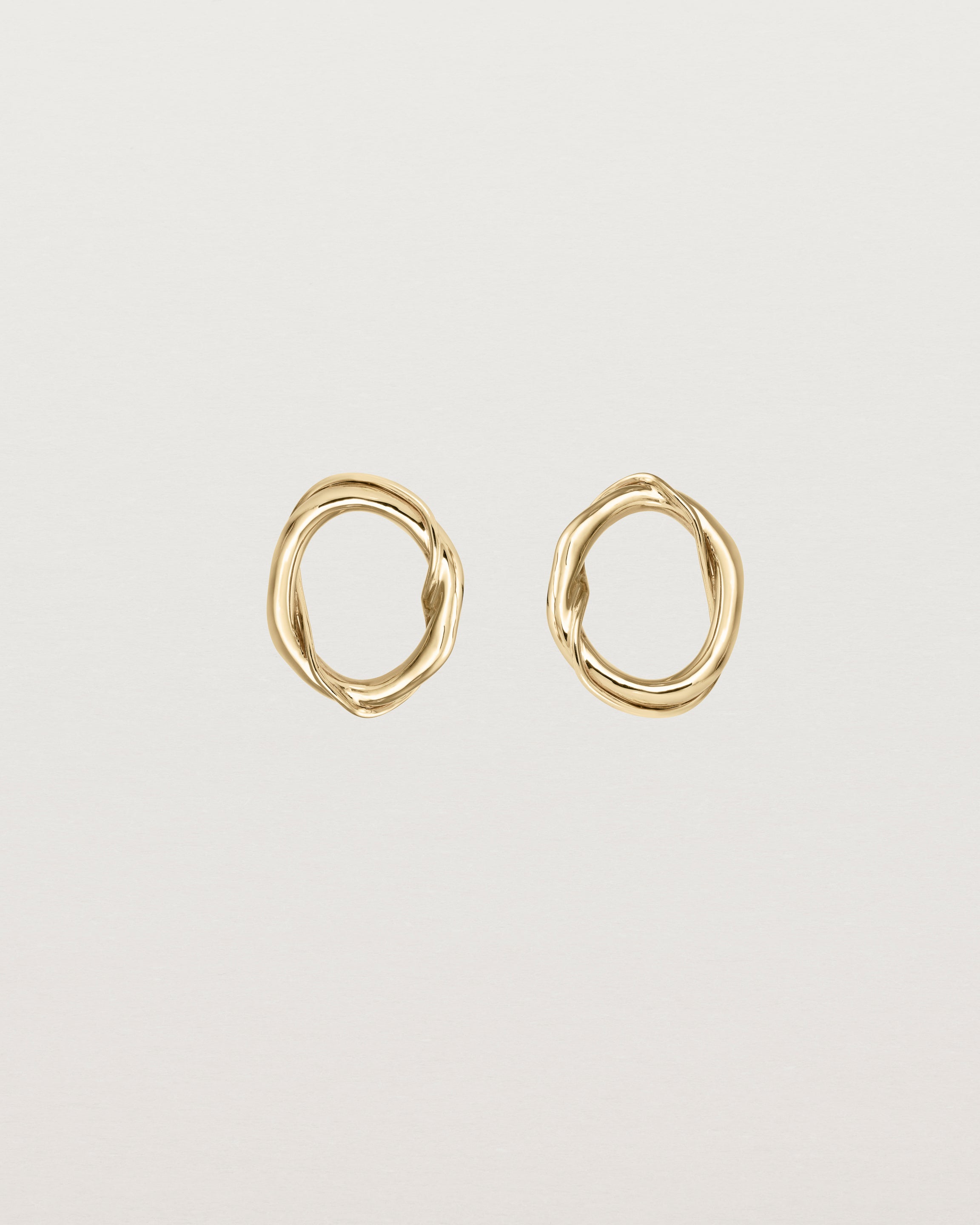 Front view of the Petite Dalí Earrings in yellow gold.