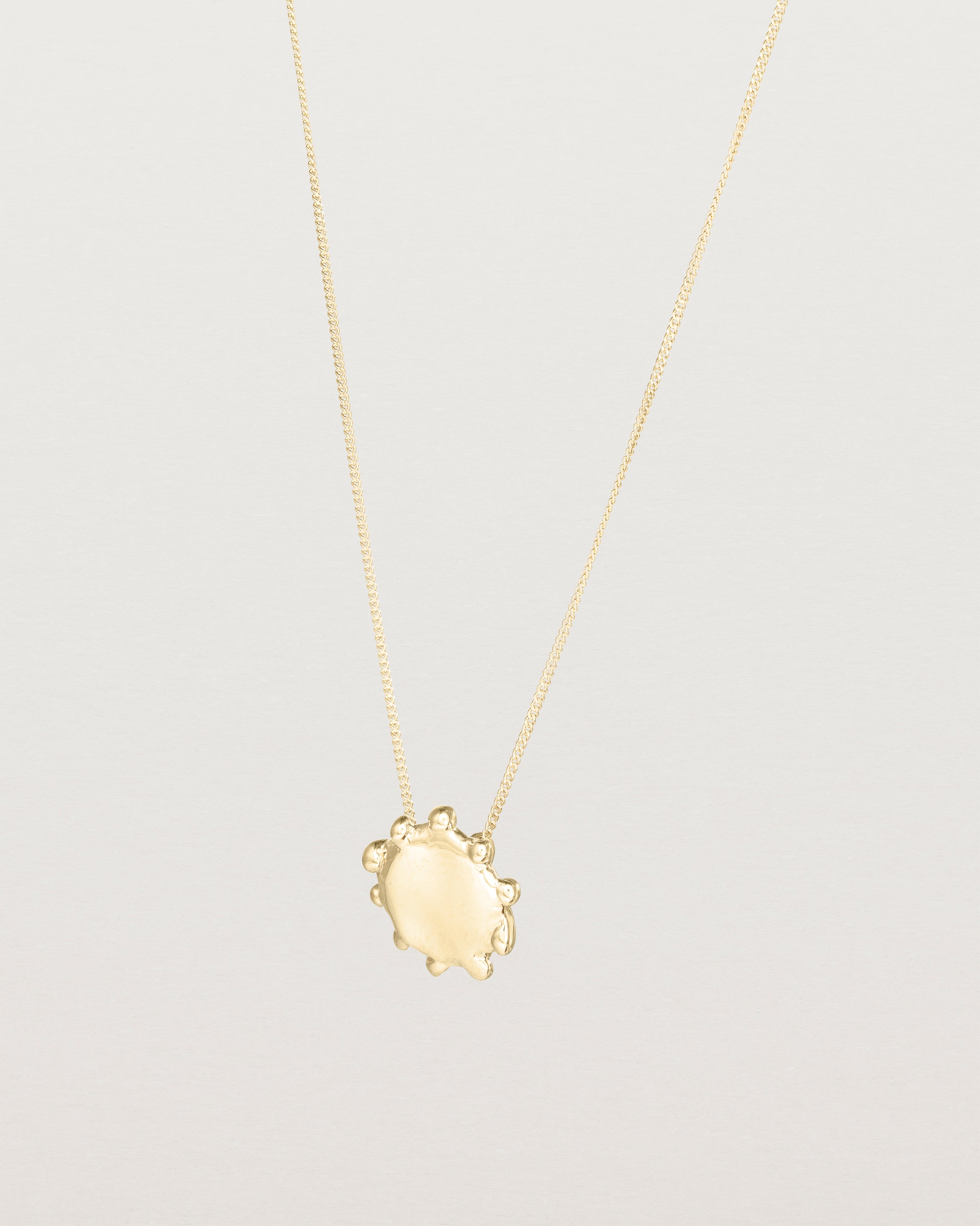 Angled view of the Petite Dotted Mana Necklace | Yellow Gold