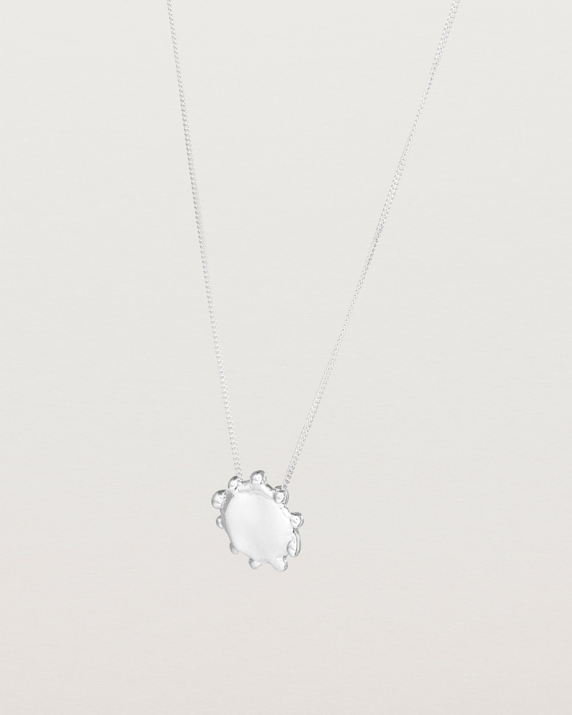 Angled view of the Petite Dotted Mana Necklace | Sterling Silver.