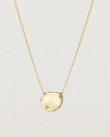 Front view of the Petite Mana Necklace in yellow gold. stone _label: Accent Stone Example