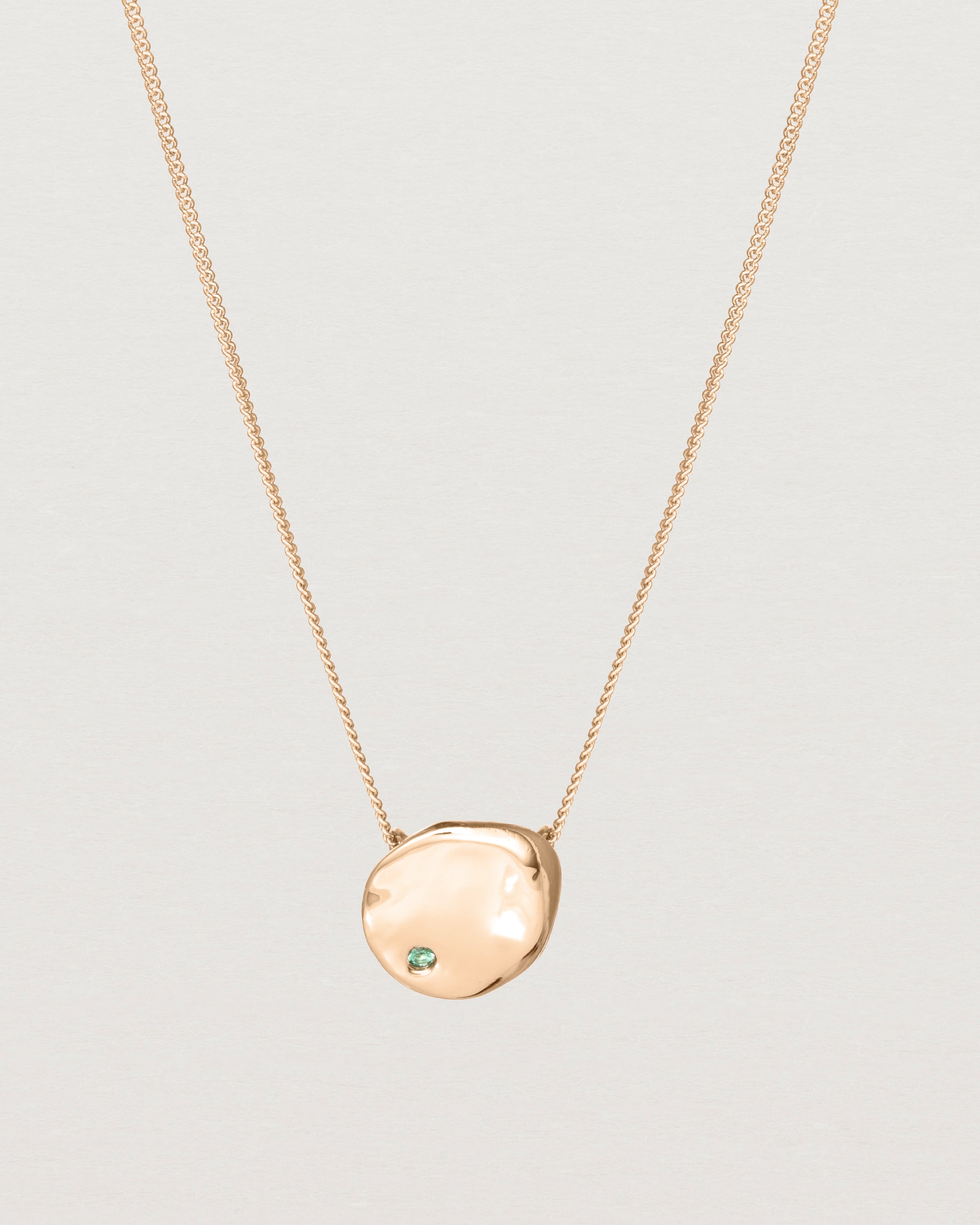 Front view of the Petite Mana Necklace in rose gold. stone _label: Accent Stone Example