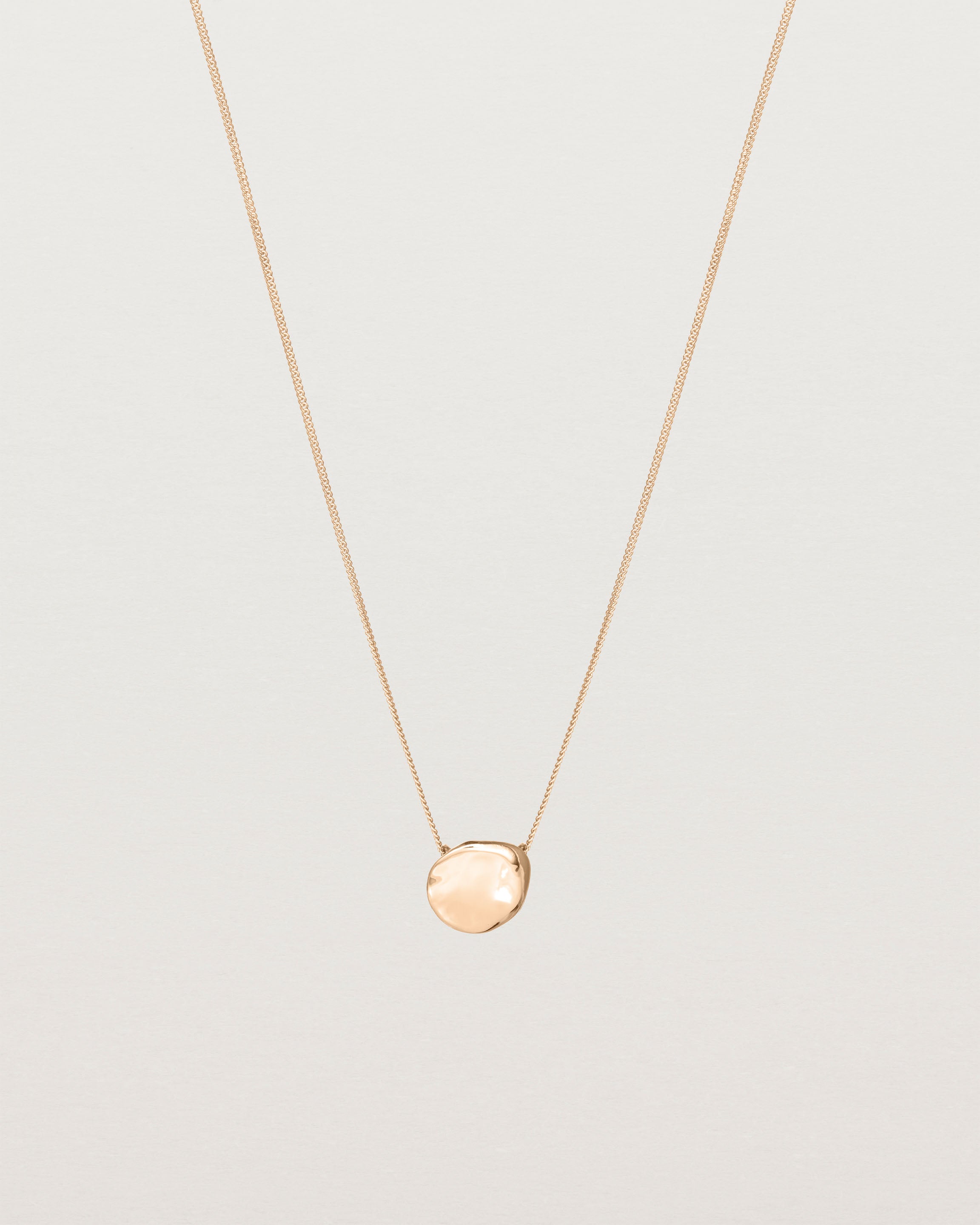 Front view of the Petite Mana Necklace in rose gold.