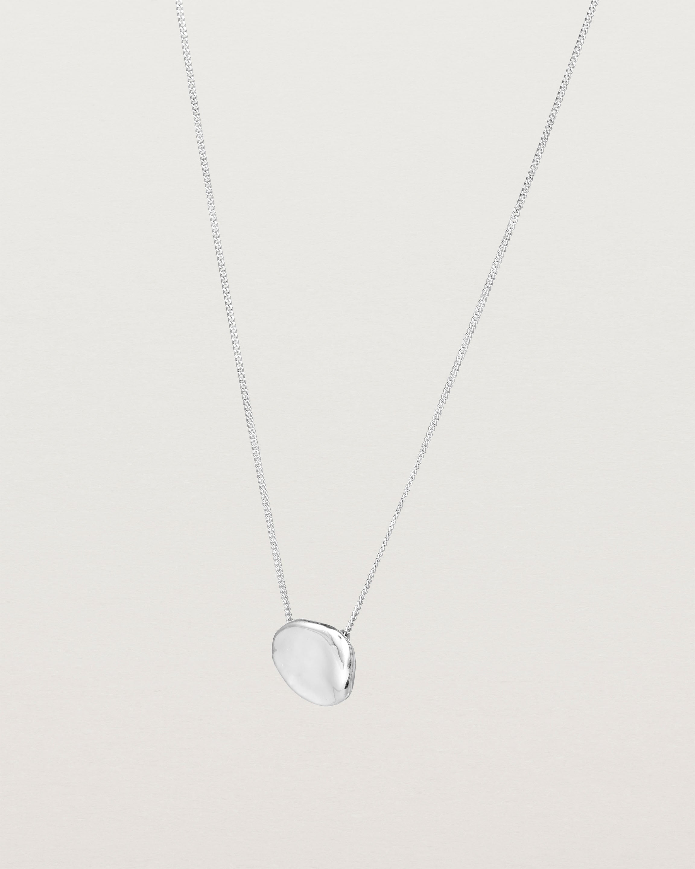 Angled view of the Petite Mana Necklace in sterling silver.