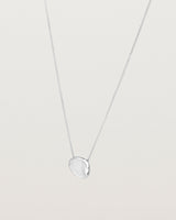 Angled view of the Petite Mana Necklace in sterling silver.