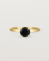 Front view of the Petite Una Round Solitaire | Black Spinel | Yellow Gold.