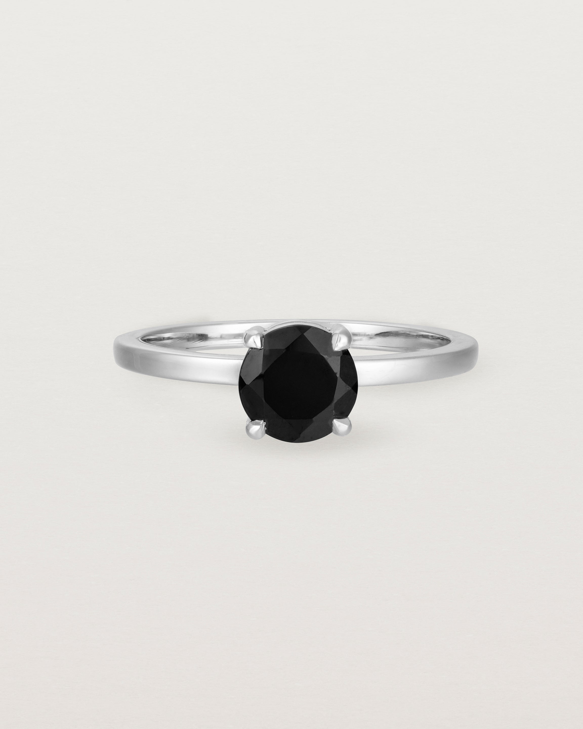 Front view of the Petite Una Round Solitaire | Black Spinel | White Gold.