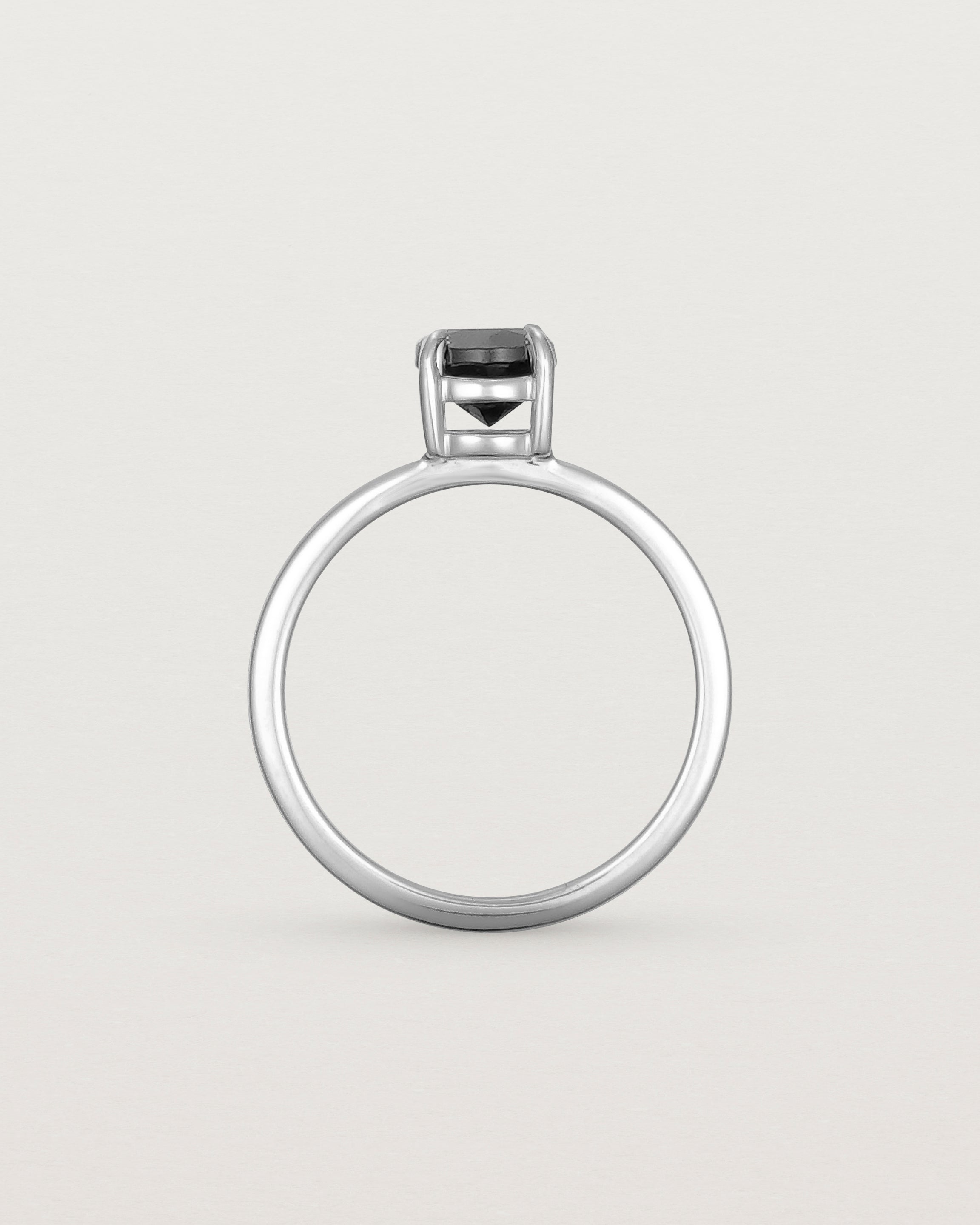 Standing view of the Petite Una Round Solitaire | Black Spinel | White Gold.
