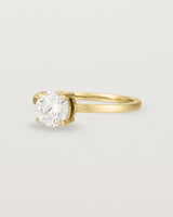 Angled view of the Petite Una Round Solitaire | Laboratory Grown Diamond | Yellow Gold.