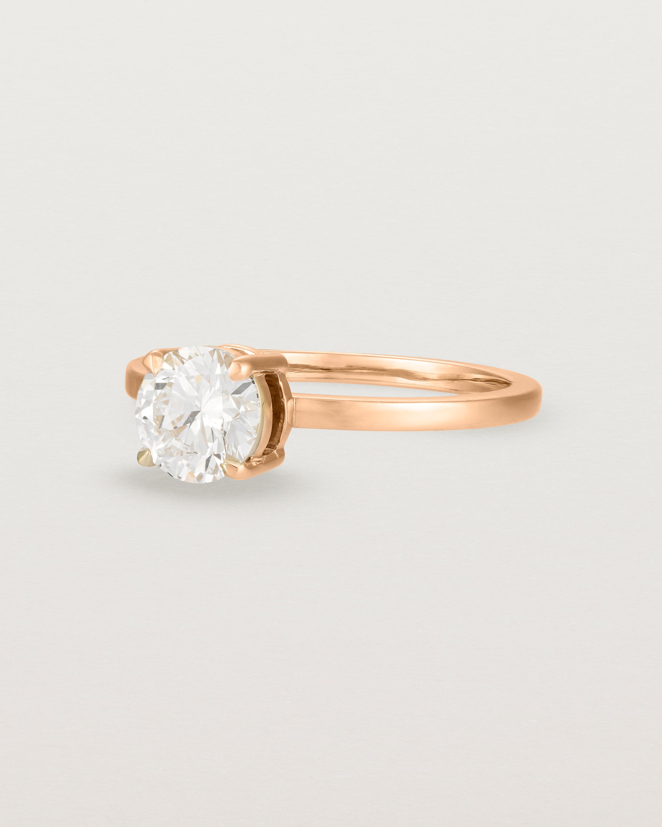 Angled view of the Petite Una Round Solitaire | Laboratory Grown Diamond | Rose Gold.