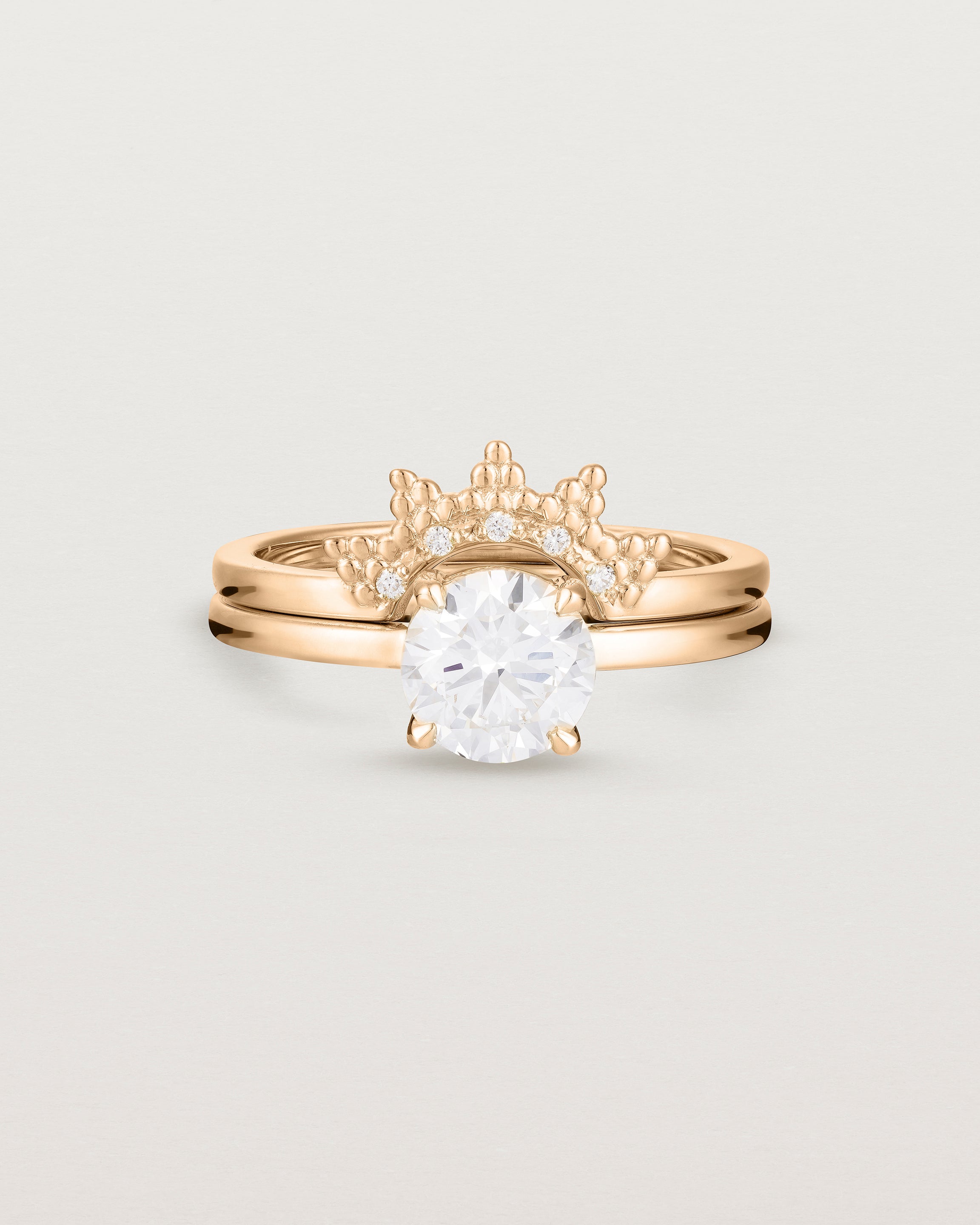 Front view of the Petite Una Round Solitaire | Laboratory Grown Diamond | Rose Gold stacked with the Odine Crown Ring | Diamonds.