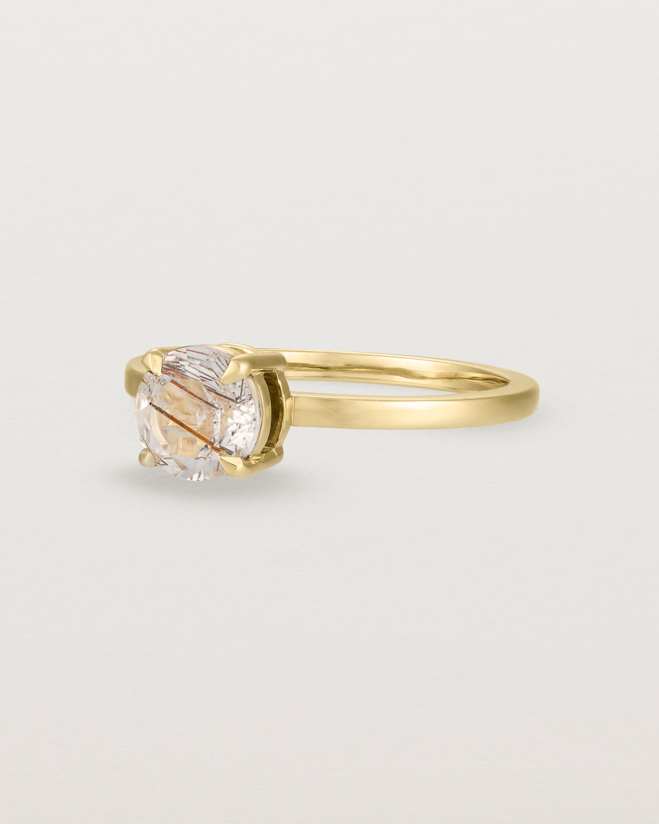 Angled view of the Petite Una Round Solitaire | Rutilated Quartz | Yellow Gold.