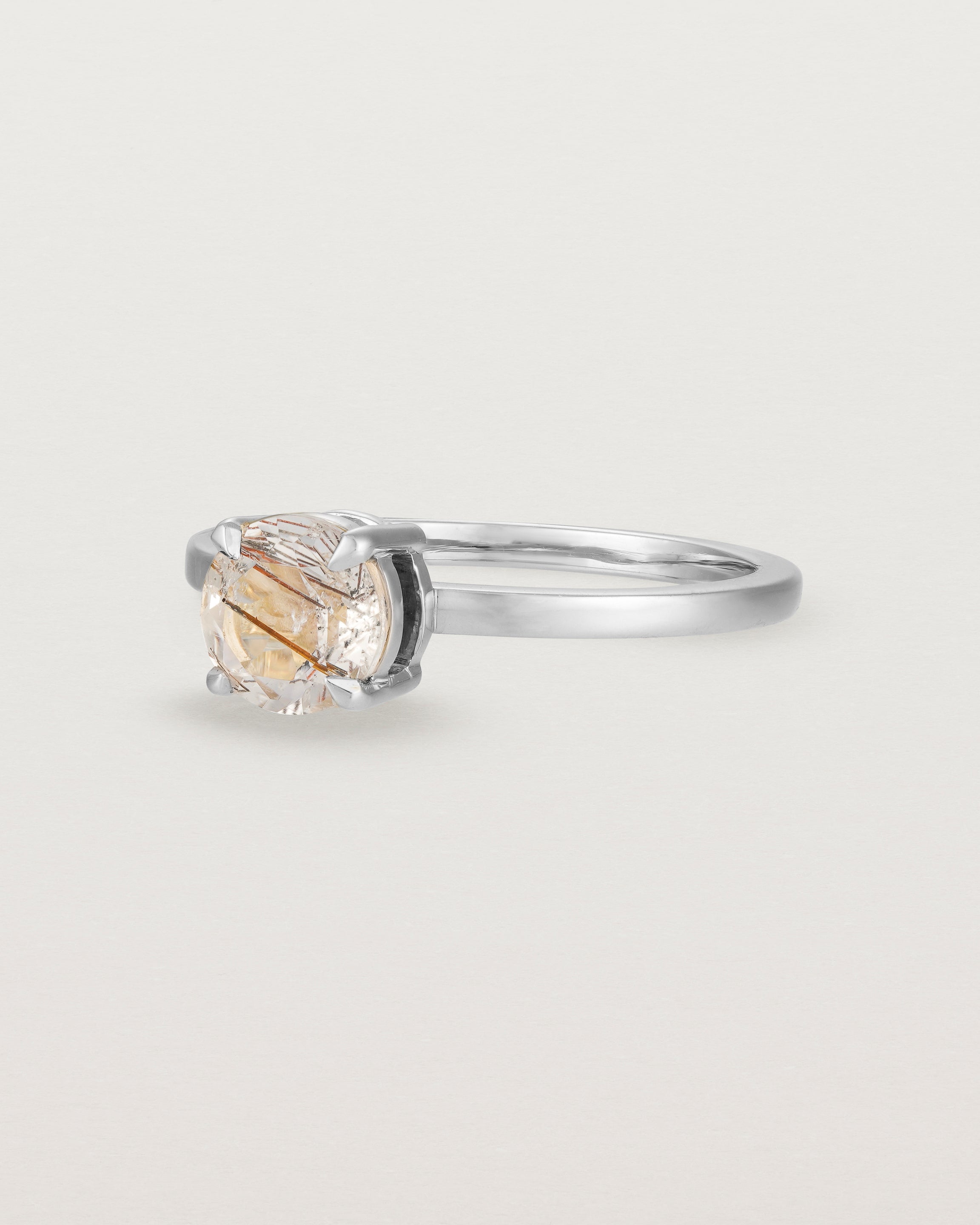 Angled view of the Petite Una Round Solitaire | Rutilated Quartz | White Gold.