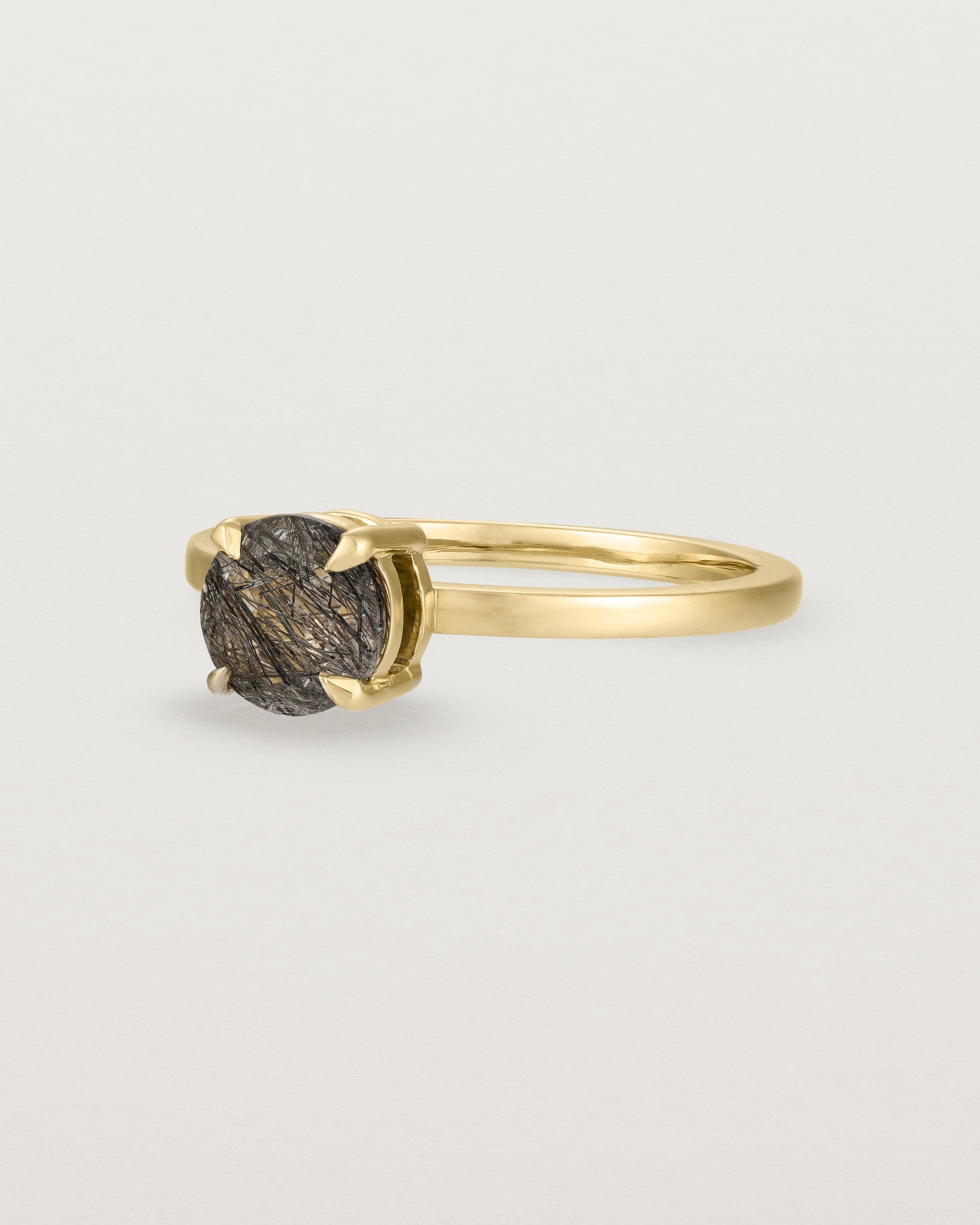 Angled view of the Petite Una Round Solitaire | Tourmalinated Quartz | Yellow Gold.