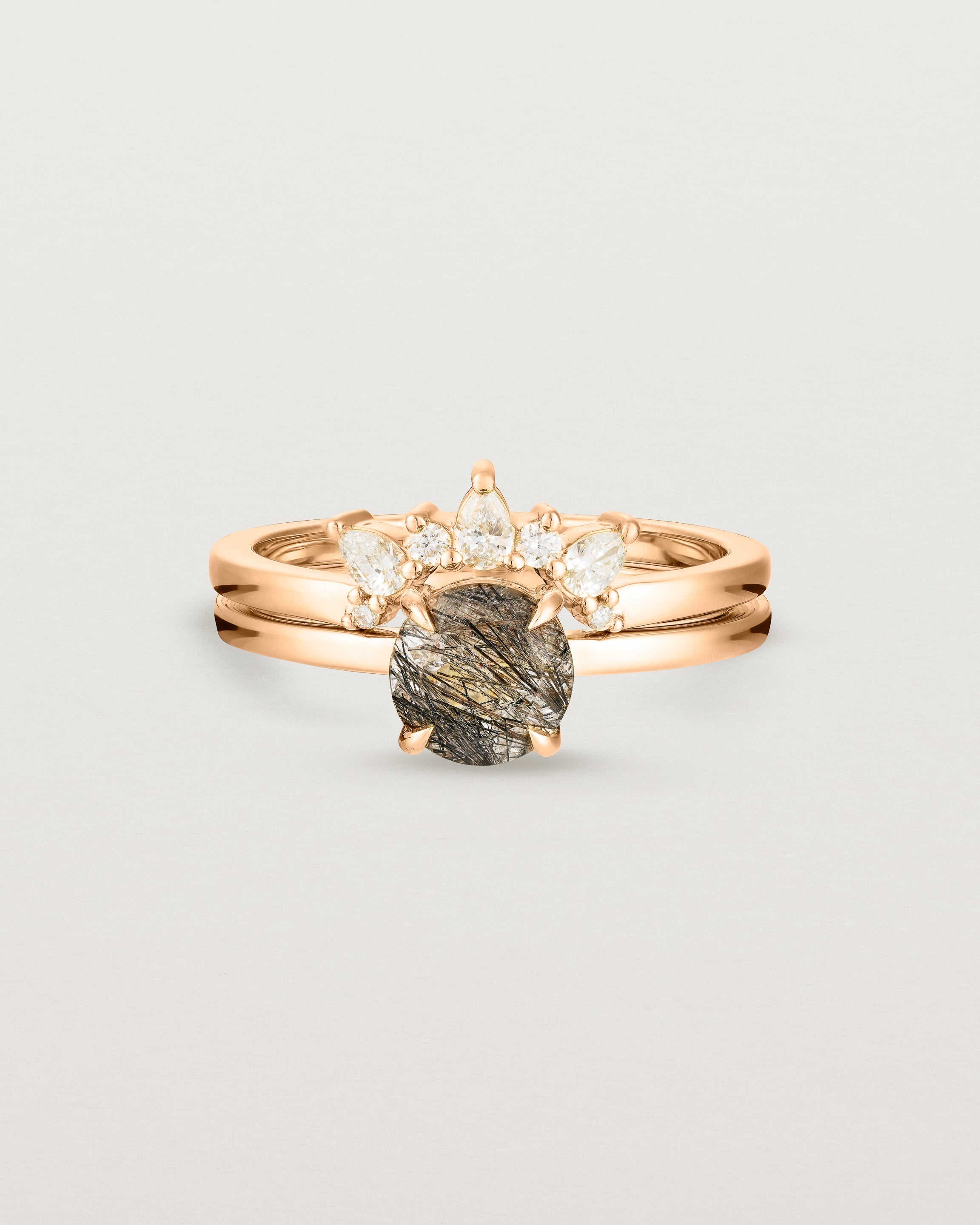 Front view of the Petite Una Round Solitaire | Tourmalinated Quartz | Rose Gold stacked with the Odette Crown Ring | Diamonds.