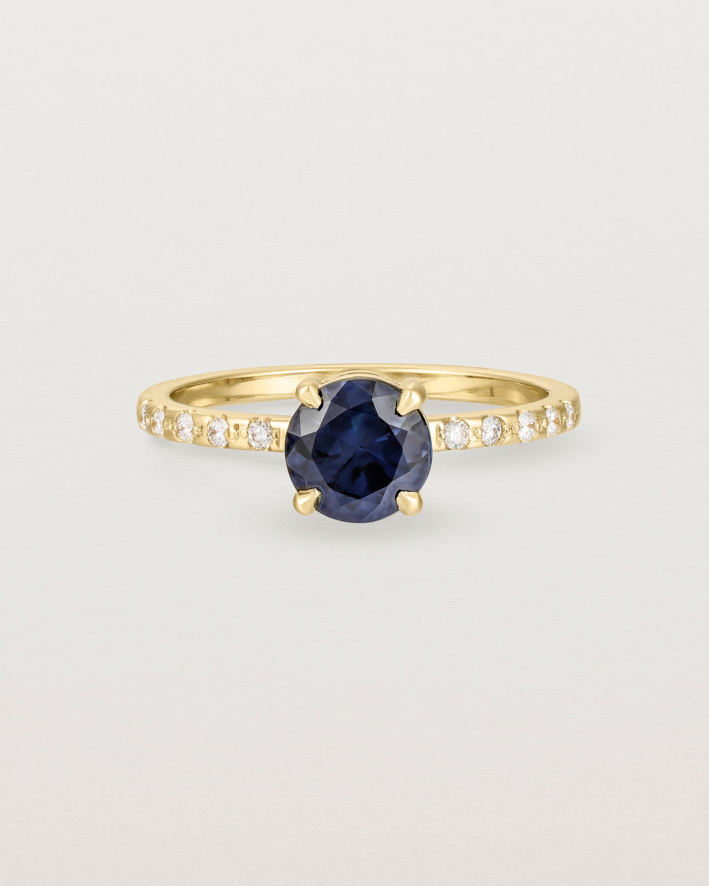 Front view of the Petite Una Round Solitaire | Australian Sapphire | Yellow Gold with cascade shoulders.