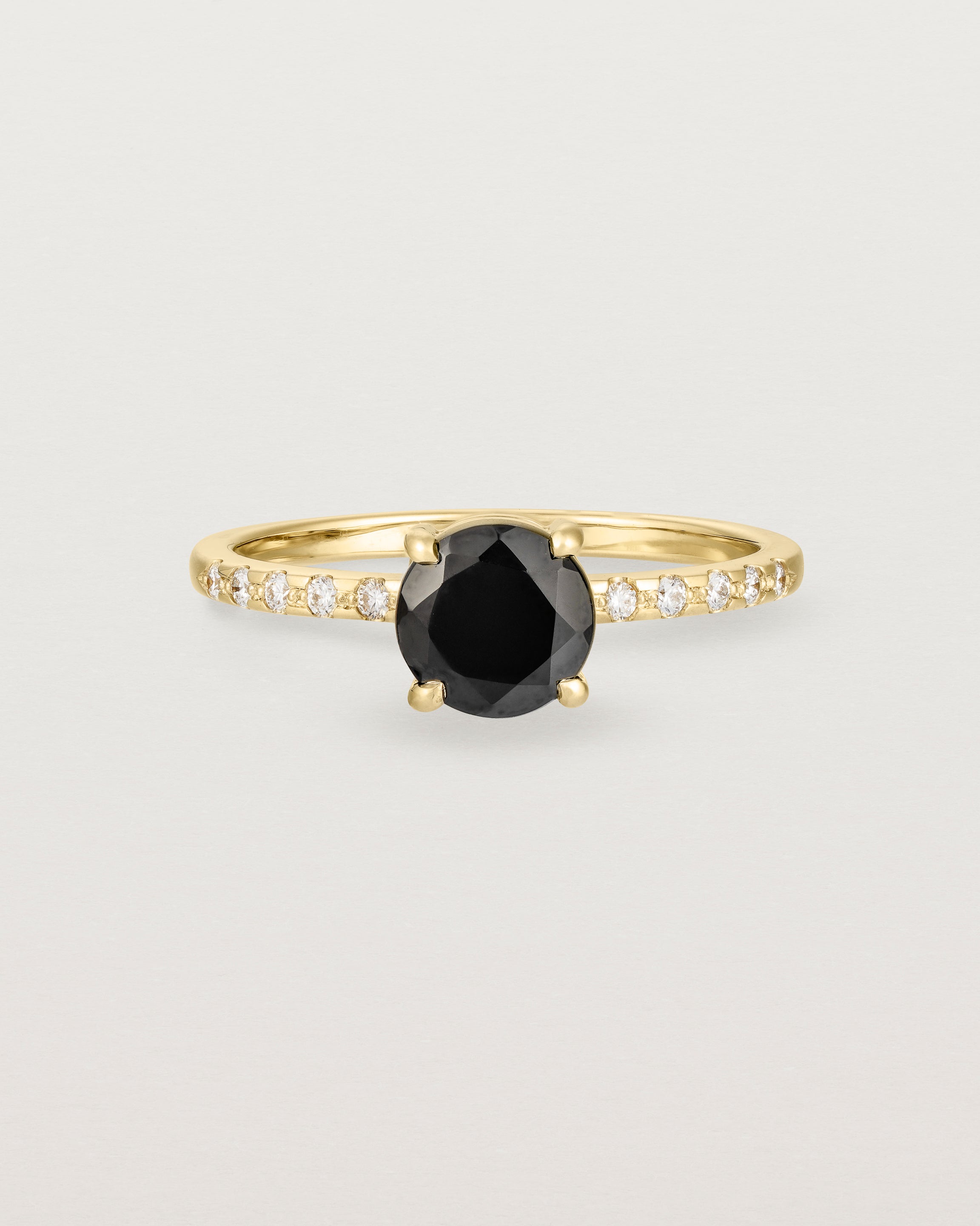 Front view of the Petite Una Round Solitaire | Black Spinel | Yellow Gold with Cascade Shoulders.