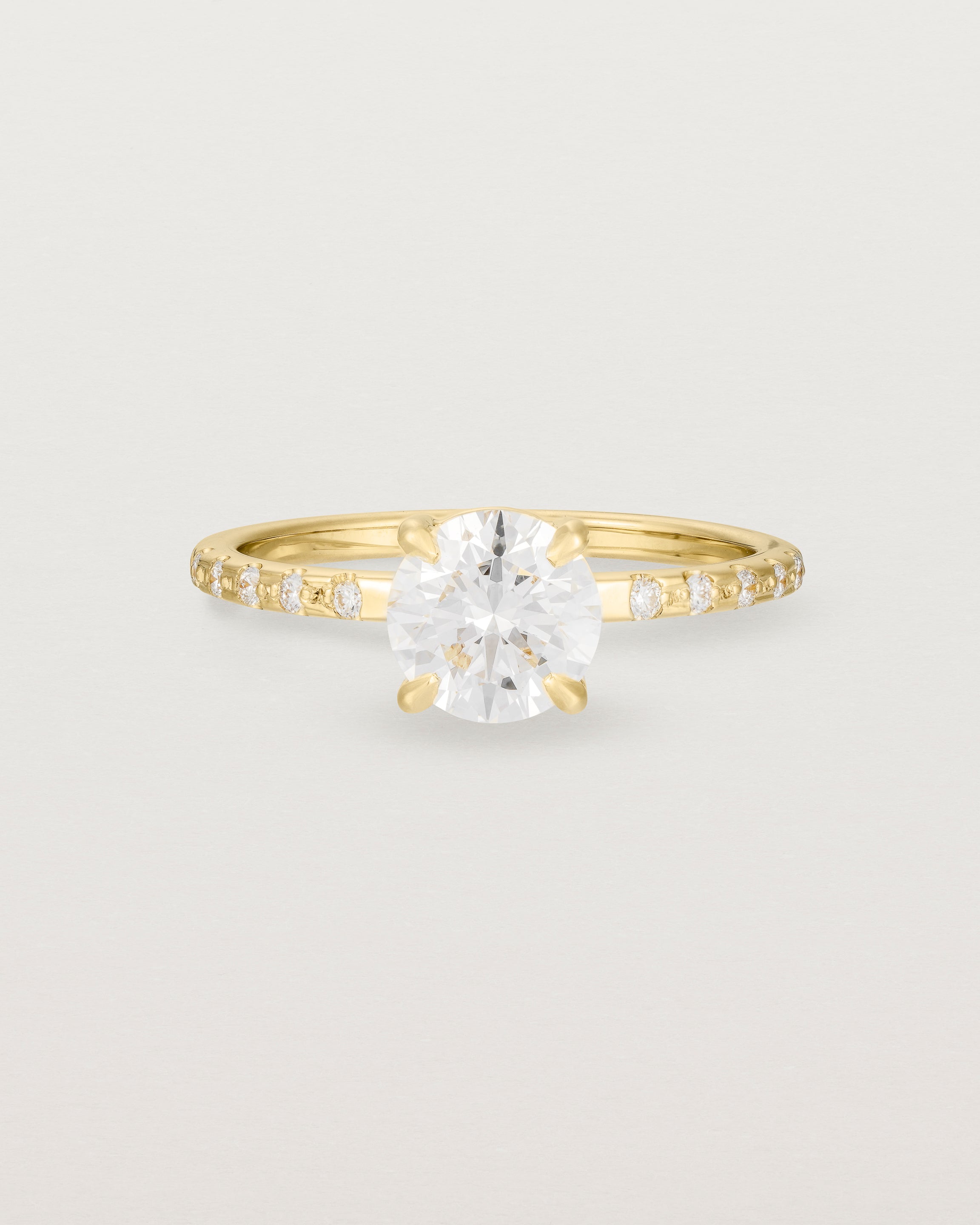 Front view of the Petite Una Round Solitaire | Laboratory Grown Diamond | Yellow Gold with Cascade Shoulders.