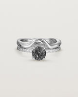 Front view of the Petite Una Round Solitaire | Tourmalinated Quartz | White Gold with Cascade Shoulders stacked with the Organic Crown Ring. 