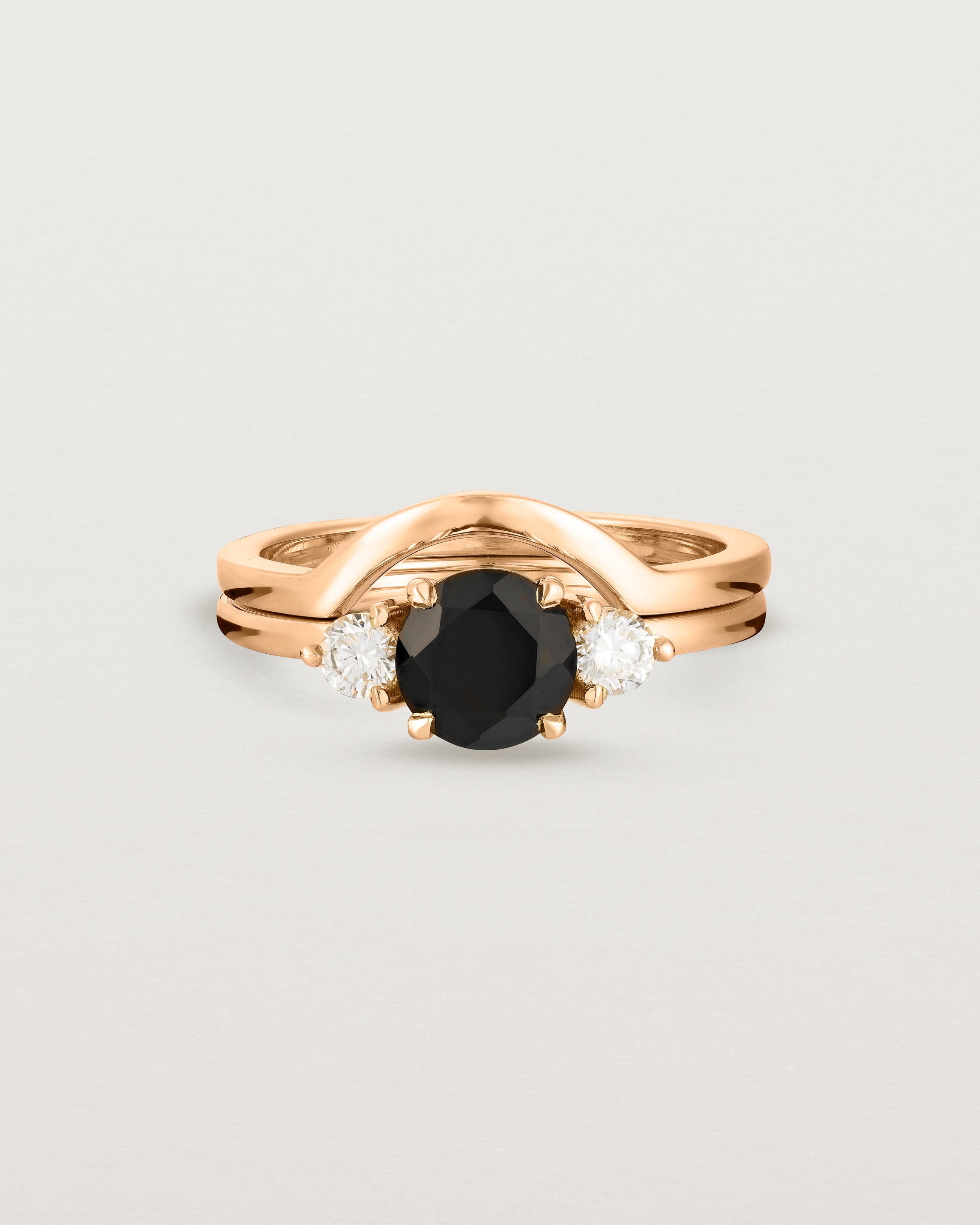 Front view of the Petite Una Round Trio Ring | Black Spinel & Diamonds | Rose Gold stacked with the Cecile Crown Ring.